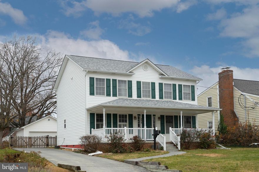 Charming 3 Bedroom, 2.5 Bath Colonial just blocks from Old Town Winchester, offering easy access to dining, entertainment, and shopping! Enjoy outdoor living on the spacious covered front porch or in the fenced backyard. The landscaping features beautiful lilac and rose bushes. The eat-in kitchen features granite countertops, a tile backsplash, hardwood floors, and newer stainless steel appliances, including a dual electric stove (2024) and refrigerator (2022). The dining room with built-ins adds character and functionality, while the family room offers a cozy retreat with an electric fireplace. Upstairs, the primary suite includes a washer and dryer (2022) conveniently located in the bathroom. Additional updates include a new roof and HVAC system (2022), refinished wood floors (2023), and new carpet on the upper level (2022). All updates approximate. A detached 2-car garage with electric provides ample parking and workspace. The encapsulated crawl space with a dehumidifier adds peace of mind. Conveniently located near both elementary and high schools, this home combines modern updates with classic charm—ready for you to move right in! Check out our 3-D tour attached to this listing!