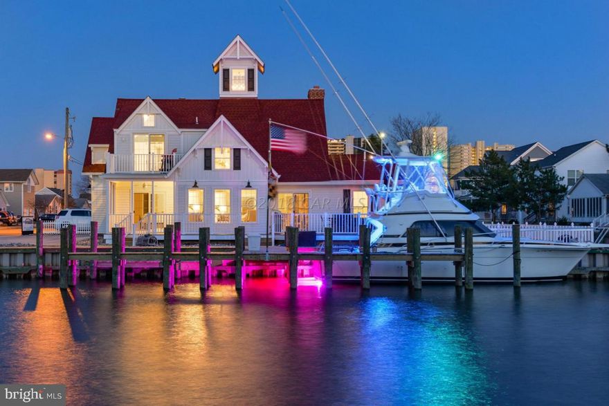 This impressive 5BR/5BA home located at 165 Old Wharf Rd is a tribute replica design honoring the historic landmark Ocean City Life Saving Coast Guard Station Museum located at the end of the boardwalk at the inlet which was originally built in 1891. Designed and built by David Bradley of Bradley Construction, a respected architectural visionary, has created yet another masterpiece. All aspect of the designs were taken from the original Life Saving Station including the white siding detail & gable details and red roof all maintenance free.  David incorporates elements from the original Life Saving Station and blended modern luxury to bring the old and new together. There are 3/BR and 3/BAa great room with wood burning-solid masonry fireplace, a gourmet kitchen and laundry.  The second floor boasts 2 additional bedrooms and baths with full laundry and fireplace overlooking the water with a walkout deck and bay view. There is 171 feet of deep water frontage easily accommodates two 45 foot boats and jet skis and a 50 ft T pier which can accommodate yet another boat up to 60 ft. There is also a large maintenance free deck and spacious yard with a private courtyard. This is a must see property and is showstopper of a home!