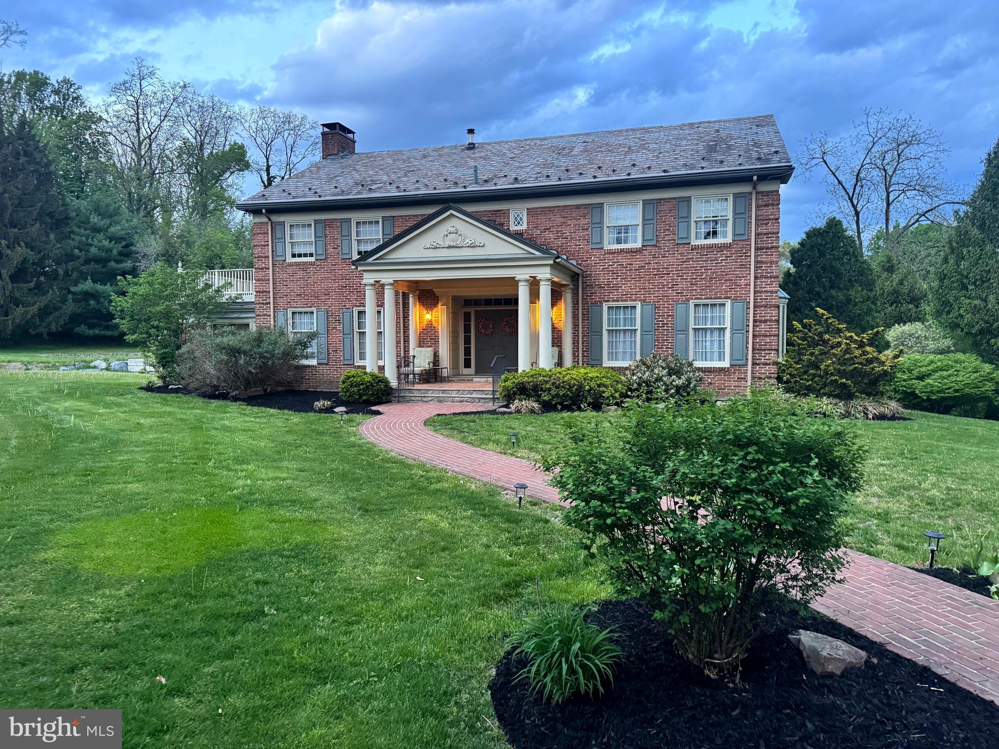 Welcome to 237 Endlich Avenue, a timeless and elegant center-hall Georgian Colonial nestled within a beautiful community of upscale private residences in the Antietam School District. This stunning estate home, custom-built for its sole owner, features 4 bedrooms and 3-1/2 baths, totaling over 6,000 square feet of living space, and boasts breathtaking curb appeal. As you approach, you'll be captivated by the grand portico with its four supporting columns and tasteful French door entryway, conveying a sense of grandeur and classical styling.
The open and airy foyer greets you with its grand, sweeping main staircase featuring tasteful woodwork and soaring views to the upper level. Custom hardscape flooring adds warmth to the space. To your left, the foyer is flanked by three distinct rooms: a sitting room, a den (or library), and a family room. The sitting room is perfect as a formal living space or music room, as the previous owners utilized it.
Adjacent to the sitting room, and a step down, is the cozy and comfortable den. It features gorgeous built-in cabinetry and an oversized wood-burning fireplace, perfect for those crisp, fall evenings. Large windows throughout the home, including in this room, provide abundant natural light.
Next is the family room, with the home's second fireplace as its focal point. This room also includes custom built-ins, a beverage bar, and an in-home theater setup complete with a motorized retractable screen.
To the right of the foyer is the elegant formal dining room. Accented with elegant trim work, crown molding, and custom built-ins, and featuring beautiful hardwood flooring, this generously sized space sets the stage for many memorable gatherings with family and friends.
The heart of the home is the expansive and well-appointed kitchen, designed to satisfy even the most demanding weekend chefs. It features abundant cabinetry, pantries, stainless-steel appliances, and enough space for breakfasts and casual dining, all while overlooking a tranquil backyard. The first-floor laundry room offers ample storage, plentiful counters for folding, a laundry chute, and can easily double as a mudroom. A study area off the kitchen and laundry room completes the main floor.
The upper level features the primary bedroom suite and three additional bedrooms. The primary bedroom is lovely and generously sized, complete with a dressing room, his-and-her closets, and a walk-in shower. The primary bedroom also provides access to an elevated balcony, perfect for morning coffee.
The three additional bedrooms are nicely sized, each offering ample closet space and plenty of room for family, guests, or a home office setup. Two of these bedrooms share a Jack and Jill bath, with a third full bath also located on the upper level.
The finished basement offers an additional 1,400 square feet of large open areas with endless possibilities—a recreation room, arts and crafts studio, home gym, or a space for entertaining, complete with a beverage bar and a cozy stove.
237 Endlich conveys meticulous attention to detail, with thoughtful features like a walk-in cedar closet, a whole-house intercom system, and a built-in central vacuum. The list goes on...
The home sits on approximately one acre of sprawling lawns and trees, ensuring privacy. It features a backyard brick patio, gorgeous landscaping, extensive hardscaping, and a gentle stream that runs through the property.
The residence is within walking distance of elementary schools, shopping, dining, athletic fields, the community pool, and the Antietam Valley Farmers and Artists Market. This is a wonderful community! Minutes from 422 and the PA Turnpike make commutes to King of Prussia, Philadelphia, and Lancaster easy. Call today for your private showing. You will love this home!