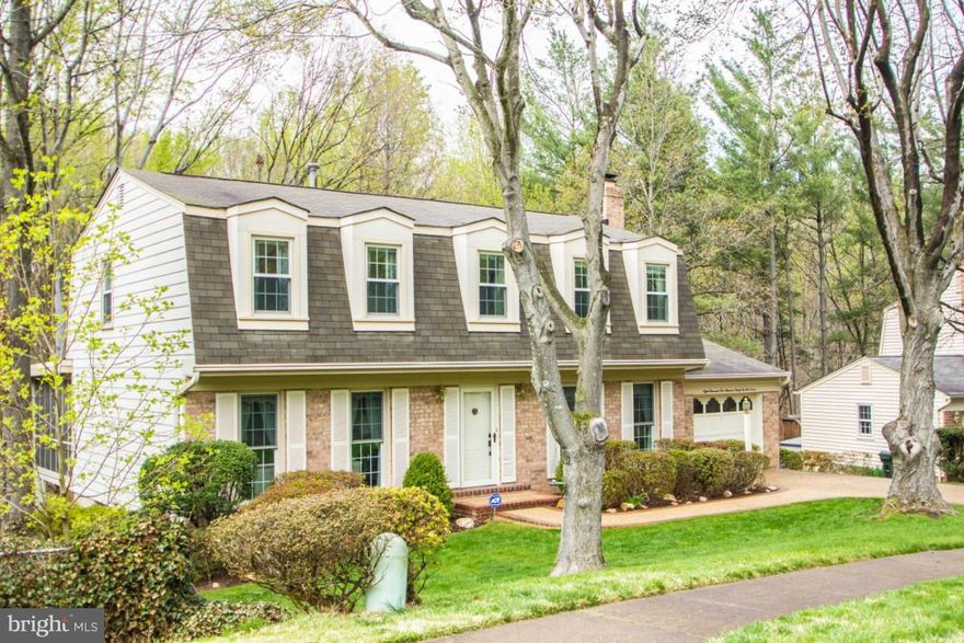 Lovingly maintained with high quality updates throughout!  All of the following have been completed in the last few years - granite counters, cabinets, appliances, HVAC, HWH, circuit panel, gas fireplace, front door, driveway, and sliding glass door!  Roof replaced in 2000!  Move-In Ready!  Backs to parkland - enjoy the view from the huge screened-in porch!  Excellent school district! Must see!