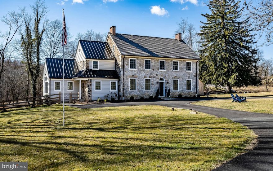 Springdale Farm was home to eight generations of the Mendenhall family from 1703 until the home fell into disrepair approximately fifteen years ago. Tastefully restored to its former glory by the current owners, the farm is on the National Register of Historic Places. This home needed everything when the current owners purchased this property – new roof, new windows, new septic, new plumbing, new HVAC, the list goes on. It is like getting an entirely new home in the body of an antique home. Set on 11.67 private acres, this federal style 4 bedroom, 4.1 bath stone home features an incredible Kitchen with a 15sf quartz island and high-end appliances. Many antique features remain, such as exposed stone walls, original floors, and preserved beams. The living room (once two rooms) has twin brick fireplaces and the dining room has a large stone fireplace. The fabulous primary suite comes complete with a wonderful bedroom, luxurious bath, fireplace, and walk-in closets. A second bedroom with en-suite bath is on the second level and two bedrooms with en-suite baths are on the third level. There is also a large Trex deck off the back of the home - perfect for relaxing and entertaining. The basement was dug out two feet to allow more headroom. There is a barn ruin that would be the ideal location for a swimming pool, garden, or stable. Next to this is located the old "Milk House". There is also a shed, that can be used for storage, a garage or a small stable for animals. A totally restored one bedroom stone Guest House and a “She Shed" with a fireplace and constructed using reclaimed beams from the barn round out this fabulous property. Convenient to Route 1 and Route 52, this property is a short drive to the Philadelphia Airport and Wilmington. Springdale Farm is also located in the Unionville-Chadds Ford School District, one of the nation’s finest public school systems.