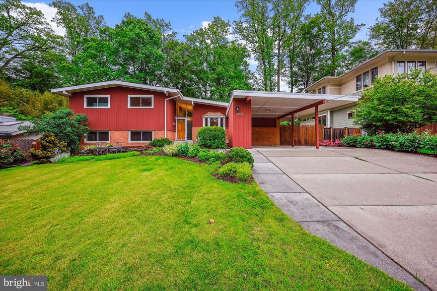 Beautifully appointed with modern proportions, this Freeman Contemporary at 8403 Westmont Terrace sits on a captivating 9,001-square-foot lot with a gorgeous in-ground pool in the highly sought-after neighborhood of Bradley Park—within the coveted Whitman High School district. Renovated and meticulously maintained, this exceptional home offers four bedrooms, three updated bathrooms, and approximately 3,468 square feet of thoughtfully designed living space across four finished levels.
Inside, the home boasts exquisite finishes, skylights, gleaming wood floors, replacement windows, and tasteful architectural details throughout. The sun-drenched main level features a spacious living room with a gas fireplace, vaulted and beamed ceilings, stunning pool views, and access to an inviting enclosed porch with recessed lighting and slate flooring. An elegant dining room with recessed lighting flows seamlessly into the renovated gourmet kitchen. The chef’s kitchen is outfitted with rich cherry cabinetry, sleek appliances, a gas range with built-in griddle, exquisite stone countertops and backsplash, a bay window, and skylights that flood the space with natural light.
The upper level includes four well-proportioned bedrooms with hardwood flooring and custom closet systems. The generous primary bedroom has a wall of closets, a ceiling fan, and an updated private bath. One of the secondary bedrooms is enhanced by a charming brick accent wall. A stylish full hall bathroom with a jetted soaking tub completes the level.
On the first lower level, you’ll find a bright family room with recessed lighting, a wet bar with wine and mini refrigerators, a brick gas fireplace, and direct access to the pool and expansive terrace—perfect for entertaining. This walkout level also includes a large office with wood built-ins and a full bathroom.
The basement level offers a huge L-shaped recreation room with built-ins, recessed lighting, and carpeting, plus a laundry/storage room.
Outside, the beautifully landscaped lot showcases colorful plantings including peonies, irises, and a weeping cherry tree. A carport, ample parking, a fenced backyard, and an incredible pool complete the picture.
Ideally located near Pyle Middle School, Whitman High School, the Landon School, vibrant Downtown Bethesda, the Capital Beltway, and public transportation, 8403 Westmont Terrace offers the perfect blend of comfort, style, and location.