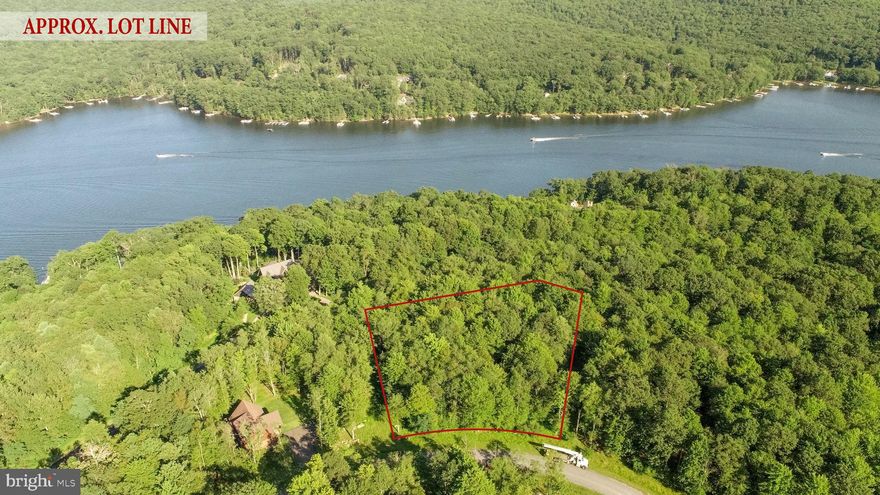 Located on Wisp Mountain in the sought-after Lago Vista community, this 1.20-acre lot offers exceptional privacy and a beautiful natural setting. The frontage is wide along the road and expands further toward the back, creating a generous building area surrounded by trees. Seasonal views of Deep Creek Lake can be enjoyed when the leaves are down, and the preserved common area across the street provides a permanent, natural backdrop for local wildlife. Just minutes from Wisp Resort, Lodestone Golf Course, and the Adventure Sports Center, this property combines seclusion with quick access to year-round recreation.