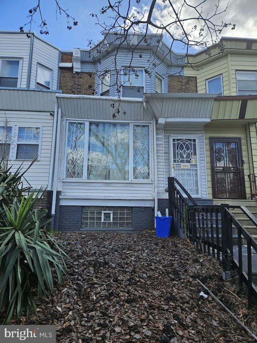 Nestled on a charming street just a half block from Cobbs Creek Park, this beautifully renovated home, with a little love and tender care could be your home.  Coming into the front door, there is a spacious porch with plenty of room for seating.  The living room and dining room give the open concept appearance, which leads into the updated kitchen, with a lot of cabinet space for storage.  On the other side of the kitchen is a 2 piece bathroom, which has been updated to compliment the property.  Beautiful size back yard, nice for family gatherings.  The basement is finished, offers an updated 3 piece bathroom, and washer and dryer.  All 3 bedrooms offer decent size and closet space, along with another 3 piece bathroom on that floor.  Will not last — schedule your showing today