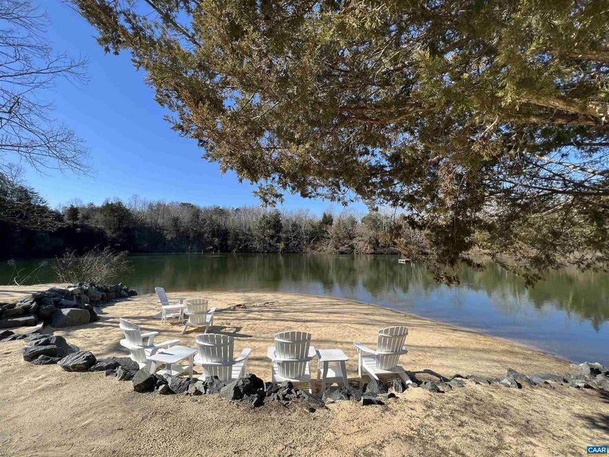 Unique building lot setting, overlooking a quarry lake.... 3 private properties share lake and access, sandy beach, cabana and 20 acres of common land (including a large utility barn)...Amazingly beautiful! Gated, private entrance...serene, private setting for the home site...road to home site in place...surprisingly convenient to Zion Crossroads and Charlottesville.