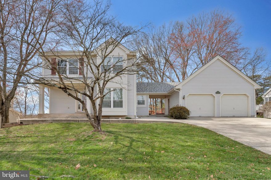 Welcome to this beautifully maintained and updated single-family home, offering the perfect blend of comfort, style, and privacy. Nestled in a serene setting backing to trees with views of the lake, this home provides a peaceful retreat while still being conveniently located near everything you need.

Step inside to discover an open-concept floor plan filled with tons of natural light, accentuated by hardwood and luxury vinyl plank flooring throughout. The main level features a spacious office/den, perfect for working from home or an additional living space. The heart of the home is the inviting living and dining area, seamlessly flowing into the kitchen—ideal for both everyday living and entertaining.

Upstairs, the primary suite boasts vaulted ceilings, creating an airy and relaxing retreat. Two additional bedrooms provide ample space, and the fully finished walk-out level basement adds even more versatility with a large storage room, a spacious laundry room, and additional living or recreational space.

Outdoor living is just as impressive! The huge deck with stairs leads to a sprawling, fenced-in backyard, perfect for entertaining, play, or simply unwinding in your private oasis. Plus, enjoy direct access to the lake, offering a truly rare and tranquil setting.

Completing this exceptional home is a detached 2-car garage, providing ample parking and storage.

Major Updates & Improvements:
- Roof (2015) – Transferrable Warranty until 11/18/2055
- HVAC (September 2023) – 10-Year Manufacturer Warranty
- Hot Water Heater (October 2020) – 6-Year Manufacturer Warranty
- First-Floor Windows (May 2019) – Transferrable Lifetime Warranty
- Second-Floor Windows (March 2020) – Transferrable Lifetime Warranty
- Chimney Cover Repair (October 2019)
- Kitchen Renovation (2019)
- Interior Paint (March 2025)
- Deck Paint (March 2025) 

Don't miss this incredible opportunity to own a home that combines modern updates, breathtaking nature views, and private lake access.