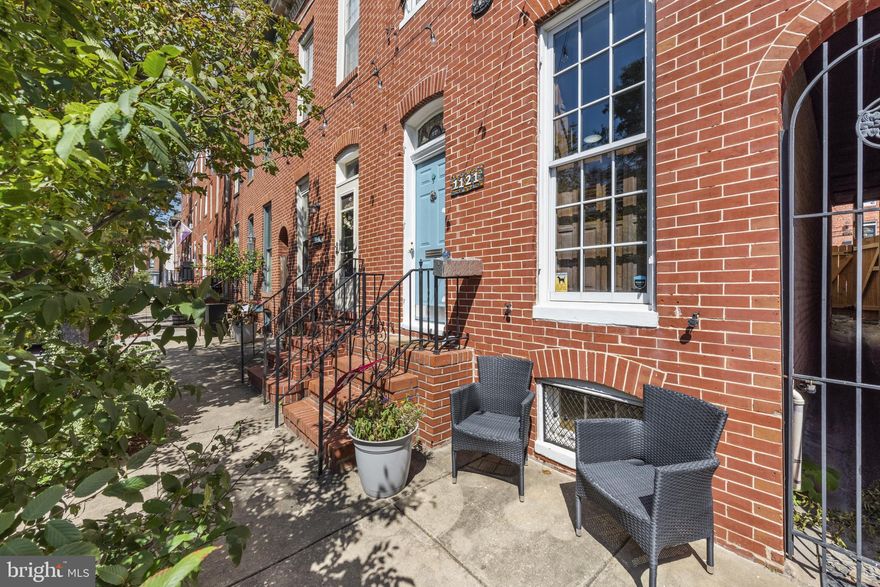 Fall in love with this Federal Hill treasure! Nestled on one of the neighborhood’s most picturesque tree-lined streets, this 3-bedroom, 1.5 bath historic home (WITH PARKING) pairs timeless charm with modern comfort. Enjoy exposed brick living room, a welcoming dining room, and a chef’s kitchen with Thermador stove. The sunny mudroom with updated washer/dryer opens to your private parking pad with Tesla charger. Updates in the past year- New main level HVAC. Updates in past 5 years include new roof, 2nd Floor HVAC , boiler, hot water heater, washer/dryer and dishwasher—make this move-in-ready gem perfect for easy city living.