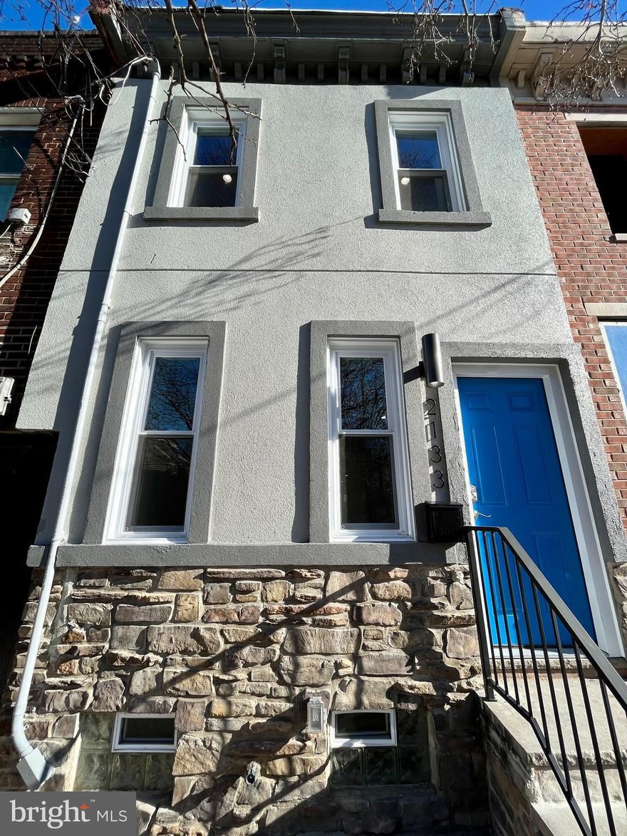 Completely renovated from head to toe in Kensington, on the border of Port Richmond + Fishtown, but without the price tag! House sits on a 13x73 lot + is about to be surrounded by new construction + development.  This 3 bedroom,  1.5 bath house has hardwood floors t/o, recessed lighting, new sheetrock, trim + paint, new windows, ceiling fans, doors, fixtures,  Smart Hvac system. New kitchen w/ granite counters,  white cabinets, + stainless steel package.    3 good size rooms w/ closet space.   Brand new bath w/ skylight + new fixtures.  Full basement basement for storage + mechanicals. New 100amp service, central air + heat and plumbing.    Net Thermostat, new stairs w/ custom rails   Everything has been completed for you. Located on a great block w/ loads of parking and no congestion.