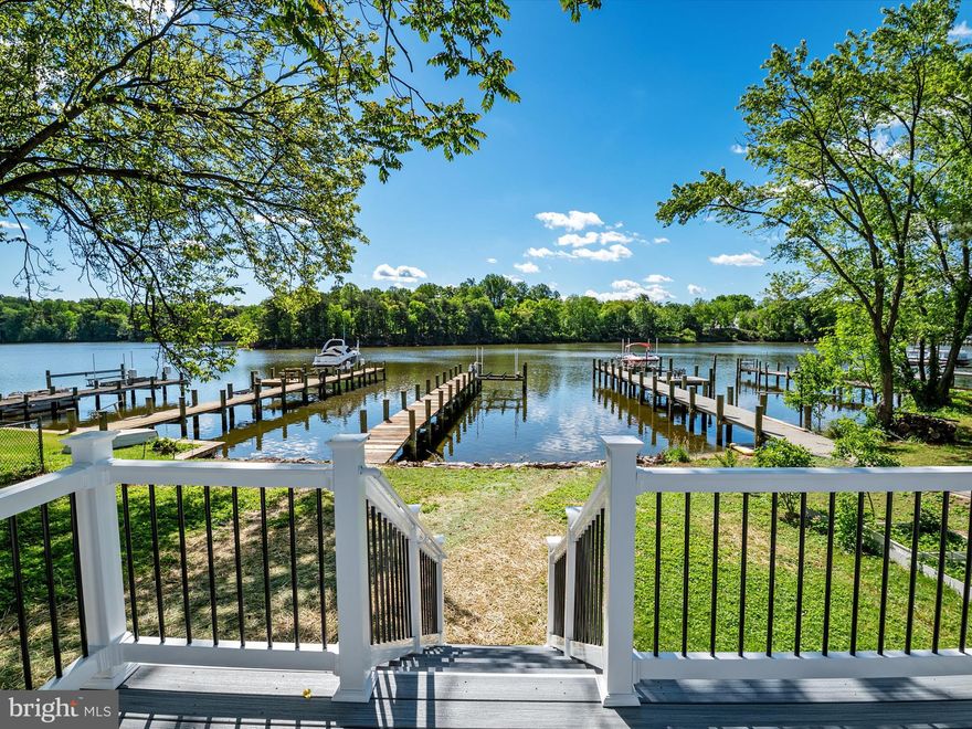 Boating season is here and 7847 Leymar Road is the waterfront home that delivers everything buyers are searching for — effortless single-level living, stunning sunsets, and a lifestyle that feels like vacation every day. Perfectly positioned on a peaceful, protected creek with no flood zone concerns and quick access to the Chesapeake Bay, this fully renovated home offers the rare opportunity to enjoy waterfront living without compromise. Step outside to your private pier with water and electric, complete with multiple slips ready for your boat, jet skis, or kayaks. Within minutes, you’ll be cruising to waterfront restaurants, exploring hidden coves, or heading out for a day on the Bay — all from your own backyard. Inside, the home has been beautifully reimagined with open, sun-drenched living spaces designed for both relaxation and entertaining. Walls of glass capture breathtaking water views, while the seamless flow from the living and dining areas into the chef’s kitchen makes hosting family and friends effortless. Every detail has been thoughtfully curated — from the quartz countertops and custom cabinetry to the stainless steel appliances and expansive island that anchors the heart of the home. Wake up to serene water views in the primary suite, complete with a spa-inspired bath, while two additional bedrooms and a stylishly updated full bath offer versatility for guests, a home office, or hobby space. Outdoor living is what truly sets this property apart, with expansive decking and a spacious waterfront yard that’s perfect for crab feasts, cocktail hours, or simply watching the sunset paint the sky. Beyond the property itself, you’ll fall in love with the welcoming waterfront community — a place where neighbors wave from their porches, kids play together on summer evenings, and boating, paddleboarding, and sunset happy hours are part of everyday life. With its no-flood-risk location, private pier, luxury updates, and a setting that blends peace, privacy, and connection, 7847 Leymar Road isn’t just a house — it’s the waterfront lifestyle you’ve been dreaming of. All that’s missing is you.