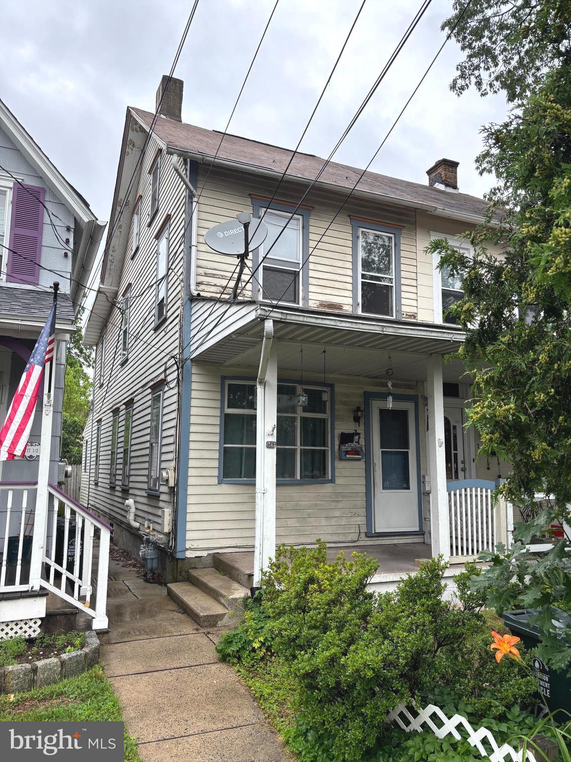 Bring your imagination and vision to this charming twin in the heart of Quakertown! This home needs some work and is waiting for the right Buyers to offer their personal touch. The first floor features a living room and dining room with hardwood floors and built-in shelving. Full kitchen incudes electric cooking and dishwasher. Behind the kitchen is the laundry room with access to the rear yard. Upstairs are 2 bedrooms, a large walk-in closet and a full bath. (One bedroom is a pass-through to the other). The third floor walk-up attic is a finished bonus room with a closet. Newer gas furnace. Full basement. Close to major routes and shopping. Memorial Park is nearby. Quick settlement possible! Owners wish to sell "as is".