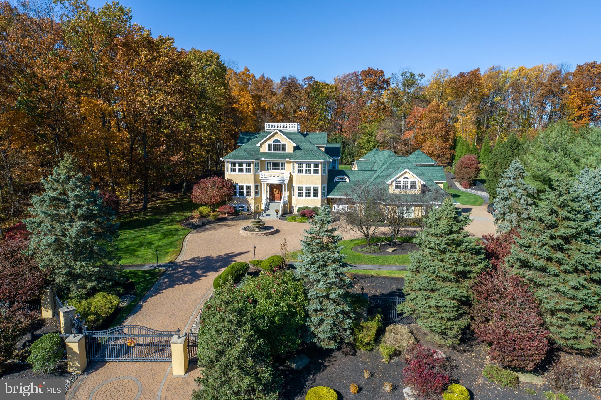 Simply stunning is the best way to describe this stately 6 Bedroom, 10 total Bathroom gated retreat sitting on 1.83 bucolic acres in Worcester township. With its laundry list of amenities, highlights of this one of a kind home include: A spectacular Indoor Pool/Hot Tub with separate Bath, third floor Movie Theater with Kitchenette, Wine Cellar with Cafe seating, Sauna Room with Steam Shower, expansive Gym, Basketball Court with outside lighting, Putting Green, scenic Walking Trail, Rooftop Deck with panoramic views, and relaxing Pond with Waterfall. Back inside the main house, you'll find an immaculate space with beautiful hardwood flooring and moldings throughout. Work from home in your large private Office/Study with gas FP and gorgeous built-ins, cook & enjoy gourmet meals in your massive Kitchen/Breakfast Room space with granite counters, extended island with breakfast bar, stainless steel appliances, gas cooking, and recessed lighting. Host Family & Friends for the holidays in your formal Dining Room with tray ceiling and double crown molding with uplighting. Upstairs, you'll find that each Bedroom has ample size and good closet space. The elegant Primary Bedroom boasts its own gas FP, sitting room with balcony access, and large Primary Bath with soaking tub, double vanity, and separate glass enclosed shower. Downstairs on the lower level, you'll find your dream hang out space with Gaming Area, extra Family Room with FP, and outside access to the paver patio courtyard. As if that's not enough, this magnificent home also boasts a private in-law suite/apartment with its own Kitchen, Dining Area, Living Room, full Bath, and Bedroom with vaulted ceiling. This property is truly a must see! Methacton Schools.