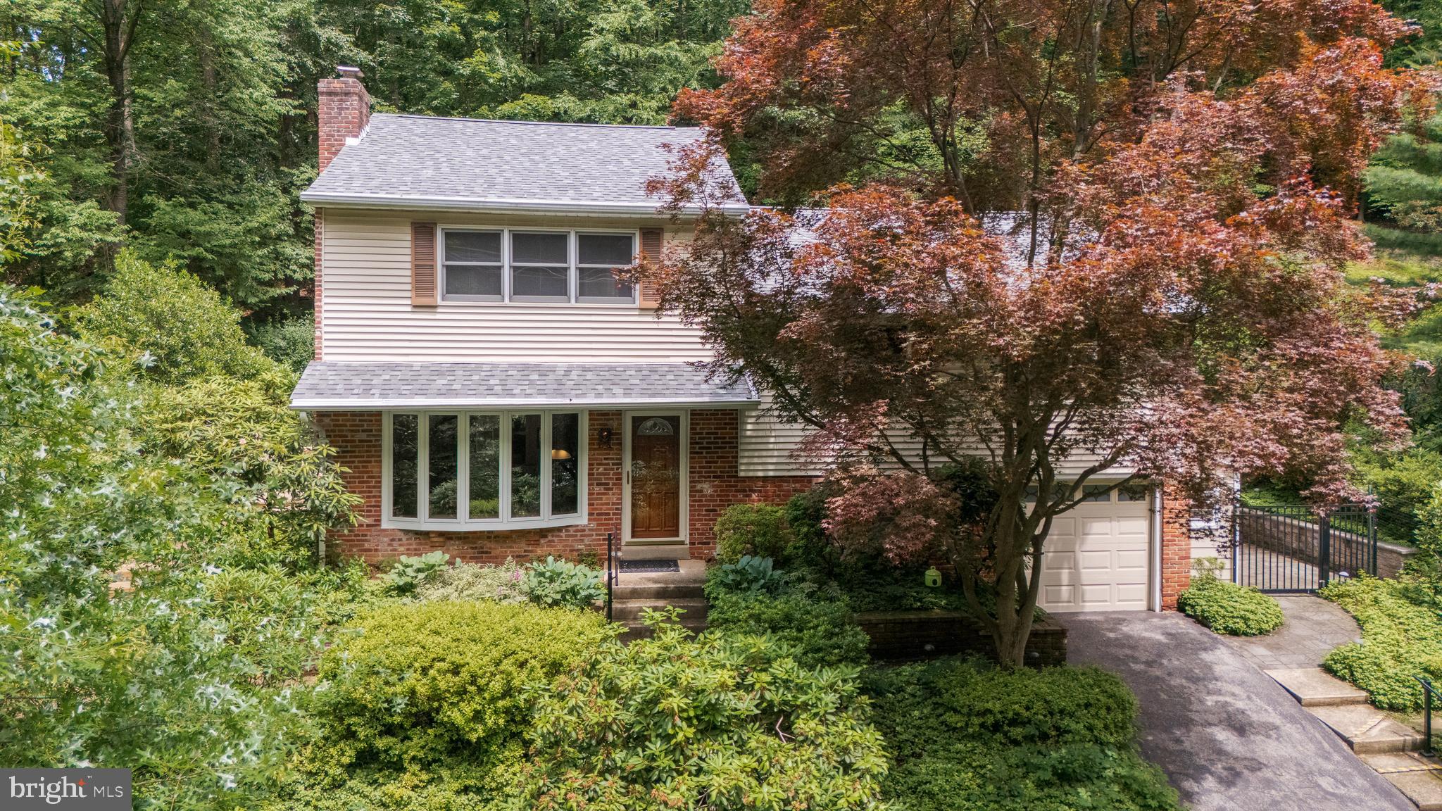 Great new price for this terrific home in Bob White Farms!
Welcome to 552 Brookwood Road, a wonderful, lovingly cared for home in the heart of the beloved Bob White Farms neighborhood of Wayne. Set on a beautifully landscaped lot and surrounded by nature, this terrific home offers four finished living levels—with great views from every window. Step into a tiled foyer that opens to the living room featuring a charming bay window and a gas fireplace with brick surround and Colonial-style mantle. A flexible room—currently used as a library or den—connects the living area and kitchen and opens to a side deck, ideal for a morning coffee. The spacious kitchen offers raised panel cabinetry, Corian countertops, stainless steel appliances, and a tile backsplash. Off the kitchen is a stunning sunroom addition, designed for year-round enjoyment. This open and airy room offers walls of windows, sweeping views of the mature plantings in the rear grounds, a vaulted ceiling with exposed wood beams, a gas stove and sliding glass doors to the rear patio, seamlessly blending indoor and outdoor living—perfect for dining, relaxing, or entertaining. The patio features built-in sitting benches and steps leading up to the rear grounds. The second level includes the original owner’s suite with a tiled en-suite bath, along with two additional bedrooms serviced by a classic hall bathroom. The third level is a wonderful primary suite, featuring a separate home office or reading nook, generous closets, and a sumptuous en-suite bathroom complete with tile extending halfway up the walls, a tiled shower, a soaking tub, and a skylight that fills the space with natural light. The lower level serves as a versatile family room, complete with a full wall of built-in cabinets and bookshelves. This level also includes a powder room, a large utility/laundry room that opens to a lower patio area, and direct entry to the attached one-car garage. Just off the patio, there is an attached storage shed—a convenient bonus for gardening tools, bikes, or seasonal storage. A walk-up attic provides excellent storage space, ideal for off-season items and long-term organization. The rear yard is fully enclosed with a deer fence to protect the lush native landscaping. The yard is a natural sanctuary, thoughtfully planted with native species that provide seasonal color, support pollinators and birds, and help manage rainwater and erosion. Composting enriches the soil, and the grounds have been lovingly enjoyed as both a sustainable garden and peaceful retreat. Located just minutes from Valley Forge National Park, Bob White Park, the King of Prussia Town Center, the Main Line, major shopping, and excellent restaurants, this home offers the perfect balance of privacy, nature, and convenience. 552 Brookwood Road is a rare opportunity to own a home that blends smart design, flexible living, and a deep connection to the outdoors. This is the one that you've been waiting for—welcome home!