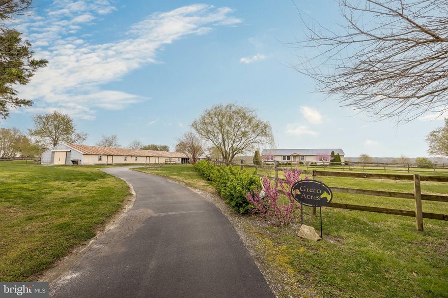 Rare opportunity to own a meticulously maintained farmette on the desirable north side of Salisbury—offering peaceful country living with close proximity to shopping and dining.

The charming ranch-style home has been exceptionally cared for and features 3 spacious bedrooms and 2 full bathrooms. Inside, you’ll find an inviting layout with two separate living areas, including a cozy space with a fireplace. The kitchen is well-appointed with newer stainless steel appliances and upgraded countertops, making it both functional and stylish.

The primary suite offers a true retreat with a walk-in cedar closet and a large en-suite bath complete with a soaking tub, separate shower, and expansive vanity. Additional closets throughout the home are also cedar-lined. Major updates include a 1-year-old water heater, newer a/c unit, and a roof  that is approximately 6 years old.

A standout feature of the home is the oversized laundry/mudroom, complete with a large walk-in storage closet and its own rear entrance—perfect for cleaning up after a day spent out with the horses. Step out onto the rear deck and enjoy peaceful views overlooking the pastures.

The exterior of this property is equally impressive. The 6-acre layout includes three well-maintained pastures that can be separated or opened into one, all enclosed with fencing and gates in excellent condition. A long, winding paved driveway adds ease of maintenance and curb appeal.

Equestrian and hobbyist buyers will appreciate the expansive 170’ x 43’ converted poultry house, thoughtfully upgraded for multi-use functionality. The front section features a 50’ x 43’ shop/garage space with full electric and lighting. The center includes a 14’ x 43’ dedicated storage area. The rear section is a fully equipped 43’ x 43’ horse stable with four oversized 14’ x 14’ stalls with mats, plus room to add a fifth stall if desired. Stall doors open into a covered 63’ x 43’ run-in area that leads directly to the pastures. Water access is conveniently available at both ends of the building.

This property truly checks all the boxes for those seeking a turn-key horse farm with modern comforts, functional outbuildings, and an unbeatable location.