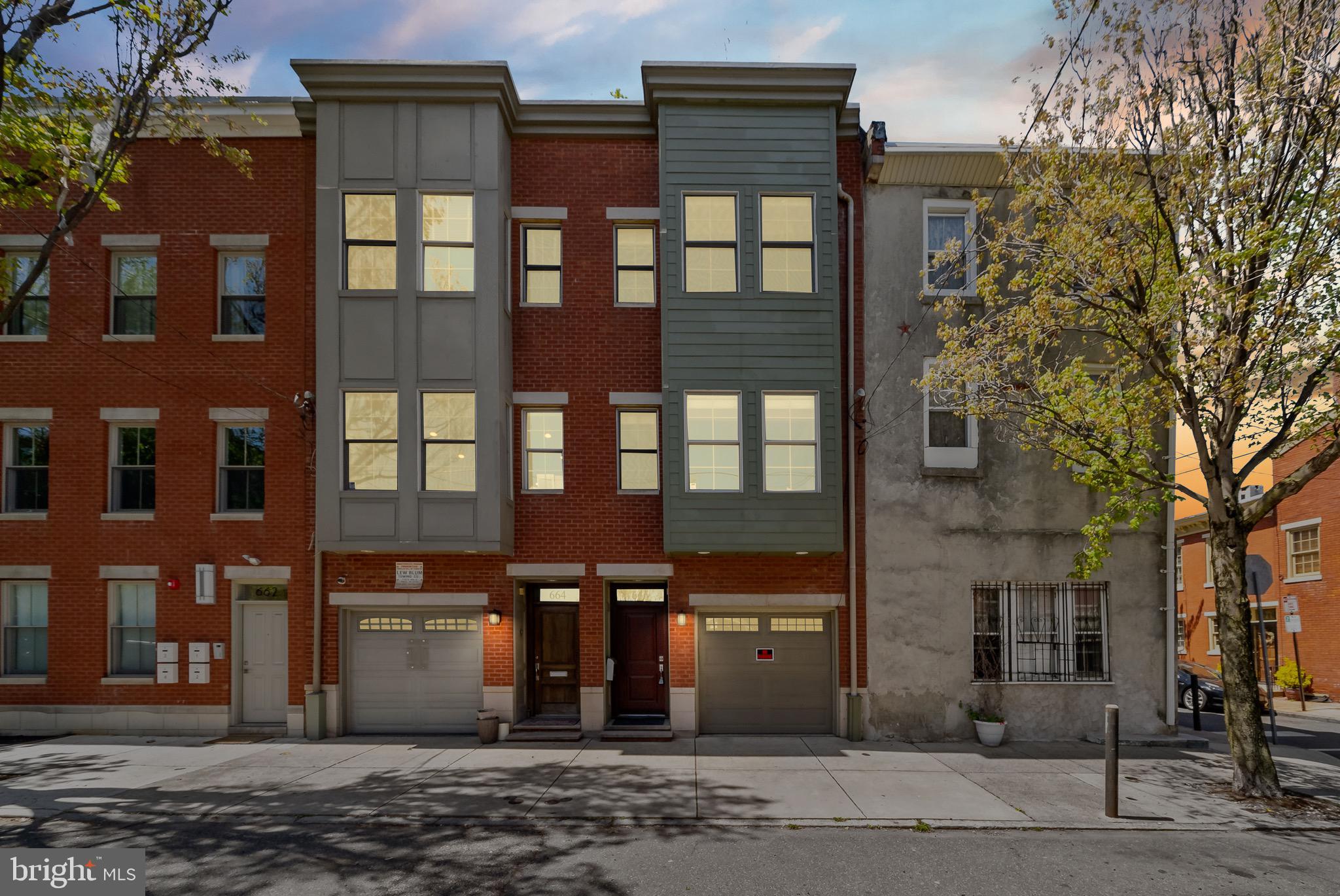 Nothing spared in this contemporary built town home in prime Fairmount location! This remarkable home features 3400+ sft of living space, 3 bedrooms on the upper levels PLUS additional private lower level bedroom with ensuite bath, 3 full baths and 1/2 bath, with 12’ ft ceilings, gas fireplace, 2 outdoor living spaces and garage parking. Amazing rooftop deck with custom retractable awning, drip irrigation system , unobstructed city skyline views and a pilot house with lots of windows to allow for great sun exposure. Inside, stunning open chef's kitchen complete with maple cabinetry, granite countertops, upgraded SS appliances, oversized island and built in dining banquette. Tons of natural sunlight fill the main floor with a deck easily accessed from the living room. Exceptional features include stunning tiger wood hardwood flooring throughout, recessed LED lighting, sconce & crown molding lighting, dual zone heating and cooling, skylights, Juliette balcony off master suite, spacious bedrooms with large bay windows, extra large modern baths boast jetted tubs, & separate walk in showers, video security/ monitors on each floor and home wired for surround sound. The handsome lower level features super high ceilings, ideal space for media /game room, or an additional bedroom for those out town guest visits with custom built in murphy bed and full bath. One cannot miss this impressive home.