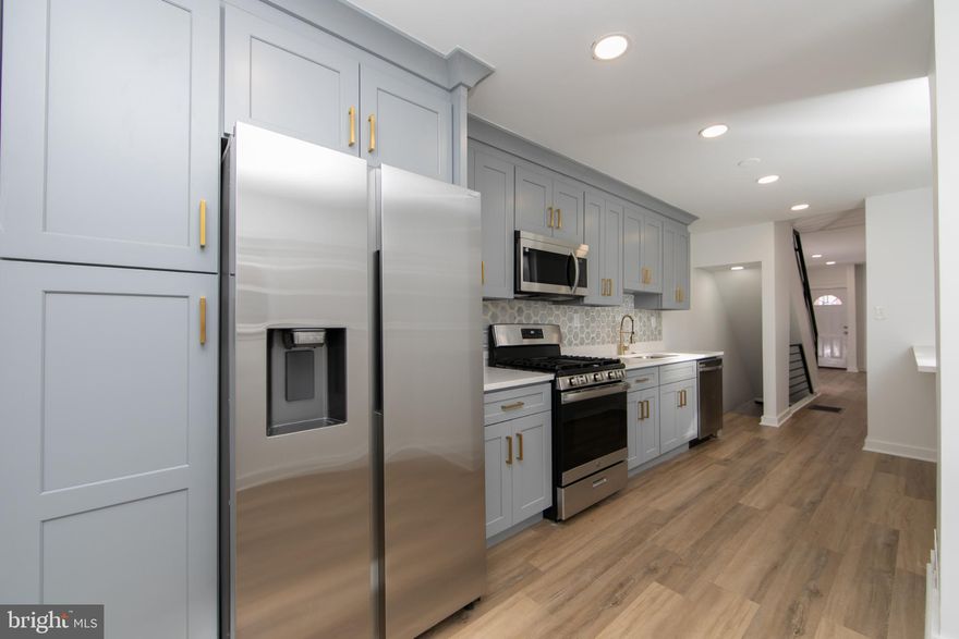 New Price! Located near Olde Kensington and just minutes from Fishtown, 2120 North 2nd Street is a beautifully updated Philadelphia home offering modern finishes, thoughtful design, and a prime urban location. This 3-bedroom, 2-bathroom residence features central air, brand new flooring throughout, fresh interior paint, and a contemporary kitchen with granite countertops and a brand new backsplash. Both bathrooms are outfitted with custom-built showers, and the home includes a dedicated laundry room for added convenience. A standout feature is the exposed semi-finished basement with modern iron railings, creating an open and stylish lower-level space with additional flexibility. Matching interior iron railings are also featured on the first and third floors, enhancing the home’s architectural appeal. Enjoy a private backyard ideal for entertaining; & the exterior has also been freshly painted recently.  Close to restaurants, nightlife, public transportation, and major development corridors, this home delivers comfort and city living at its best.