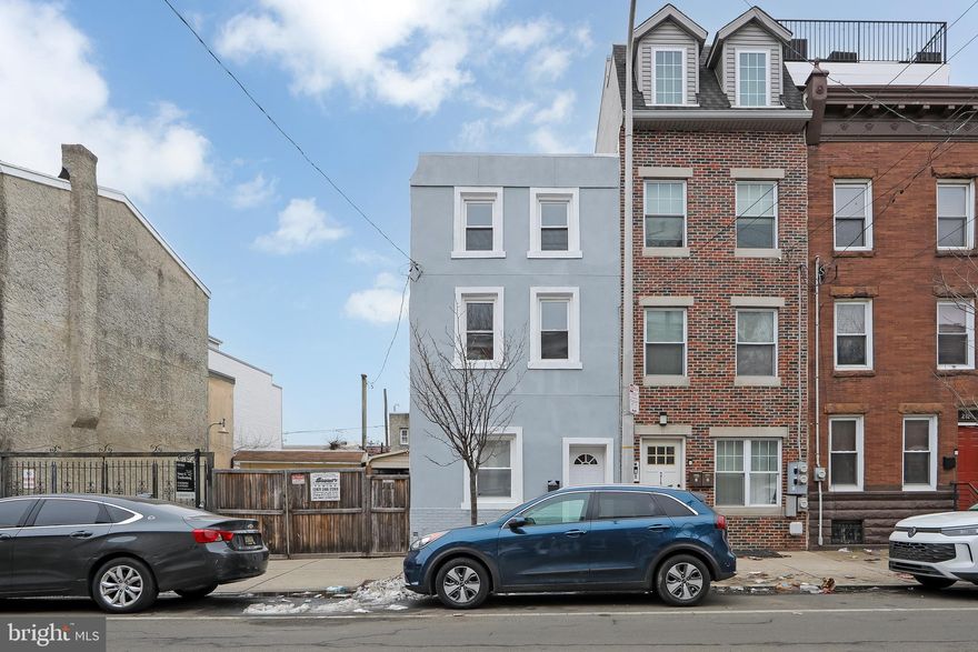 New Price & $3k in seller concessions! Located near Olde Kensington and just minutes from Fishtown, 2120 North 2nd Street is a beautifully updated Philadelphia home offering modern finishes, thoughtful design, and a prime urban location. This 3-bedroom, 2-bathroom residence features central air, brand new flooring throughout, fresh interior paint, and a contemporary kitchen with granite countertops and a brand new backsplash. Both bathrooms are outfitted with custom-built showers, and the home includes a dedicated laundry room for added convenience. A standout feature is the exposed semi-finished basement with modern iron railings, creating an open and stylish lower-level space with additional flexibility. Matching interior iron railings are also featured on the first and third floors, enhancing the home’s architectural appeal. Enjoy a private backyard ideal for entertaining; & the exterior has also been freshly painted recently.  Close to restaurants, nightlife, public transportation, and major development corridors, this home delivers comfort and city living at its best.