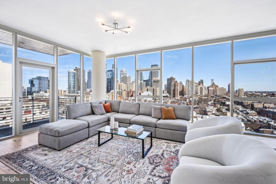 Discover unparalleled city living in this rarely available 02-floor plan at One Riverside, one of Philadelphia’s premier luxury condominium buildings in the heart of Fitler Square. This expansive 4-bedroom, 4.5-bath home spans nearly 2,600 sq ft, offering breathtaking panoramic views of the Schuylkill River, FMC Tower, and the Philadelphia skyline. With a bright, open layout and two private terraces, this residence is designed for both sophisticated entertaining and effortless everyday living.
The spacious living and dining area is enhanced by 10' ceilings, wide-plank walnut flooring, new lighting fixtures, and custom cabinetry, creating an elegant yet inviting atmosphere. Floor-to-ceiling windows flood the space with natural light, while a north-facing terrace provides a serene outdoor retreat. A true chef’s kitchen boasts Sub-Zero appliances, marble countertops, a Miele wine refrigerator, and a built-in wall oven with a microwave.  

The primary suite is a private sanctuary featuring a large sitting area, two walk-in closets with custom built-ins, and a spa-inspired marble bathroom with an oversized infinity whirlpool tub, a spacious stall shower, and a double vanity. The second bedroom includes an en-suite marble bath with a stall shower and ample storage, while the fourth bedroom, currently used as a home office, is outfitted with custom wood bookshelves and showcases stunning views of the river, bridges, and Art Museum. A laundry room with generous storage adds convenience to this thoughtfully designed home.

This residence also benefits from 2 years remaining on the tax abatement and valet parking for two cars. One Riverside offers an exceptional suite of full-service amenities, including 24-hour concierge and valet parking, a heated indoor 60' lap pool, a state-of-the-art fitness center with Peloton bikes, locker rooms with saunas, steam rooms, and showers, a chauffeur-driven town car, a catering kitchen, a boardroom, a guest suite, and a private landscaped park with an outdoor patio and grill.

Located just steps from the Schuylkill River Trail, this prime location provides easy access to University City, top hospitals, Rittenhouse Square, 30th Street Station, and Center City’s best restaurants and shopping.
Don’t miss this rare opportunity to own one of One Riverside’s most coveted residences—schedule your private showing today.