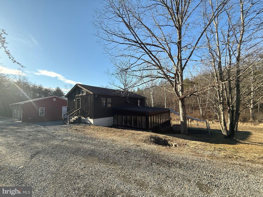 Opportunity knocks with this 4-bedroom, 2-bath home on 2.02 peaceful acres in Capon Bridge. Perfect for an investor, handyman, or buyer looking to add value.
The main level of this home offers a functional layout with a welcoming living area and a well-sized kitchen,
The large 24x35 detached 3-car garage provides ample storage or workspace, making it ideal for hobbyists, car enthusiasts, or additional rental income.
Located in a prideful homeownership community, this property offers privacy and space while maintaining easy access to U.S. Route 50 and Winchester, VA. Enjoy small-town charm, and nearby river access for outdoor recreation. A wet weather stream runs through the property, adding to its natural charm and potential for outdoor enjoyment.
Minutes from the Cacapon River, perfect for fishing, kayaking, and hiking.
Enjoy local favorites like Farmer’s Daughter Market & Butcher and community events year-round.
Whether you're an investor looking to expand your portfolio, a first-time homebuyer, or a contractor ready for a new project, 221 Heavenly Lane is full of potential!