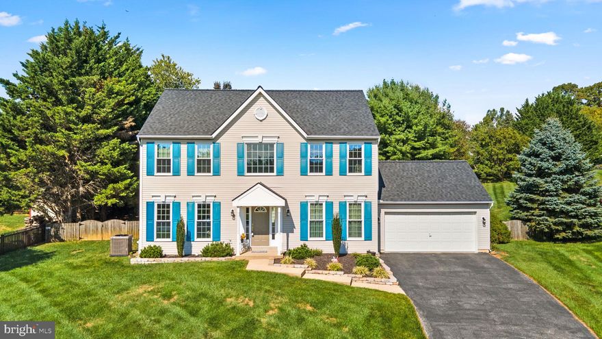 Beautifully maintained and upgraded by the original owners, this stunning colonial sits on a landscaped
.54 acre homesite with an in-ground pool in a friendly Harvest Farms cul-de-sac.
Blending style and space, this home features a sun-filled 2-story foyer welcoming you and your guests
inside to find a formal living room showing off profile crown moldings, a study, and
a dining room ideal for hosting dinner parties accentuated by crown molding, chair rail trim, and a ceiling
medallion atop the chandelier. Unwind in the sunfilled open family room centered by an ambient stone fireplace, a breezy ceiling fan creating a comfortable environment, and a perfect site line view of the kitchen. Ready for your best creative dishes is this cook's kitchen boasting ebony appliances, ceramic tile flooring, granite counters, harmonizing mosaic tile backsplash, 42" raised panel cabinetry, an "L" shaped peninsula island with breakfast bar, and a breakfast room with bay architecture and a glass slider opening to a paver patio with a retaining sitting wall, and backyard oasis with an in-ground pool with
concrete decking. Huge owner's suite presents a deep tray ceiling with a lighted drop fan, a sitting area, 2 walk-in closets, and a garden bath including a double vanity, a separate shower, and a relaxing platform soaking tub. A nice finish to this home is the spacious lower level highlighted by a rec room, a game room with built-ins, bonus space, a walk-up to the yard, and dedicated storage. Private yet close to commuter routes, shopping, golf courses, country club, and everything offered in both Howard and Carroll counties.
