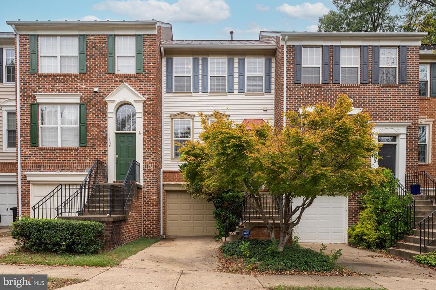 Welcome to a bright, freshly repainted and professionally cleaned townhome set in an ideal Reston location just minutes to Reston Town Center, commuter routes including Leesburg Pike (VA-7), and everyday essentials.

On the main level, an extremely open layout greets you with modern finishes and great natural light. The entertainer's kitchen sits up front perfect for gathering flowing into a spacious living and dining area. A powder room adds convenience, and sliding doors open to the backyard for easy indoor outdoor living.

The upper level offers three generously sized bedrooms and two full baths, providing comfortable separation of space and an easy daily routine for everyone.

The lower level delivers standout flexibility: a large recreation room with fireplace, a full bathroom, in-unit washer/dryer, and a kitchenette with abundant cabinetry plus closet space and egress windows, making this level functional as a guest suite or fourth sleeping area. Interior access leads to the attached 1-car garage, and there's additional guest parking available on the street.