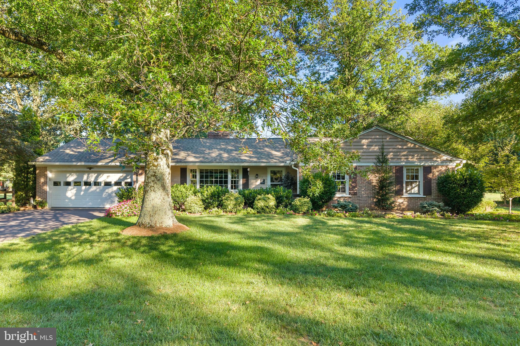 Welcome home to this Jonas Hagey built 1960’s brick ranch home with 4 Bedrooms, 1.5 Bathrooms, and a 2-Car Garage on a flat, expansive 1.46 Acres in Lower Salford Township. This home has been meticulously maintained and had many updates over the years, including central air, electric panel, washer, dryer (2023), gutters & leaf filter (2021), roof (2020), and many more. Enjoy the mature landscaping surrounding the front porch with room for chairs and a table to enjoy the outdoors. Enter the slate foyer into the Living Room with a hardwood burning brick fireplace. The home features a traditional layout with hardwood flooring throughout the Living Room, Hallway, 3 of 4 Bedrooms (carpeted bedroom has hardwood underneath). From the Living Room you can see straight thru the Dining Area towards the back yard and beautiful screened in porch with brick flooring and knee wall, and wood beamed cathedral ceiling (2004). Enjoy the view of your massive flat yard with large shade trees, raised garden beds, and a swing set playground (2004). Inside, the thoughtfully planned Kitchen was remodeled in 2003 and has special features including a double drawer dishwasher, double pantry beside the refrigerator, an appliance garage, granite countertops, newer stove & microwave (2018), laminate hardwood floors, backsplash, and a skylight. Thru the Kitchen is you Laundry area, the powder room, garage and basement access. The four Bedrooms are the opposite side of the home and share the remodeled Bathroom (2012) with radiant heat floors, and separate shower and tub. Downstairs is the finished Basement with a recreational room with the second wood burning fireplace, a Kitchenette with vintage 1950’s fully working electric range, currently used for preserving. There’s two large storage closets, a storage room that could be finished for more entertainment space, and a carpeted room with closet, currently used as a sewing room. Additional home features include a central vacuum system, all house fan, crown heater (2005), and windows replaced in 2005. This lovely home is conveniently located on Harleysville Pike, minutes from Rt 63, Rt 73, and the PA Lansdale turnpike entrance.