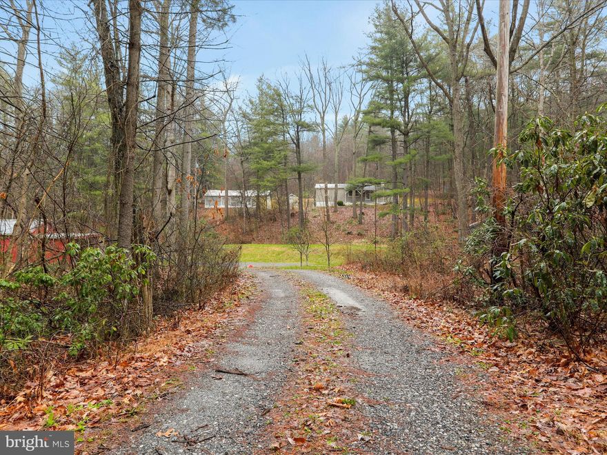 Have you been looking for your very own mountain sanctuary or cabin in the woods? Look no further! This property is nestled on 4.74 acres of mountain ground! There is a 3-bedroom 1 bath mobile home with a cistern and septic system in place. There is also a 20 x 40 garage with overhead door, a large workshop with electric and a large storage shed. Want a homestead?? We already have the chicken coop for you, too! With a creek on the property, you can self-sustain as little or as much as you wish! Ready for a home away from home? This would be perfect for that as well, with direct access to State Game Lands. Great for hiking and more! Please note this is a cash or conventional sale only.
