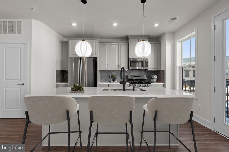 Discover a brand new TOWNHOME-STYLE CONDOMINIUM by Van Metre Homes at DEMOTT & SILVER is available for you to call home NOW! Spanning 2,246 finished square feet across 4 levels, the CAMERON 24-R1-RT floorplan offers an unparalleled blend of sophistication and convenience. As you step inside, natural light floods the main level, illuminating the expansive great room and the elegant rear-set kitchen, complete with upgraded cabinets, tile backsplash, quartz countertops, and stainless-steel appliances. Upstairs, the lavish primary suite awaits, boasting a large walk-in closet and a spa-like 5-piece bathroom complete with double sinks, an attractive soaking tub, and an oversized, frameless shower enclosure with a built-in seat, a place to rejuvenate and prepare for the day's adventures or to unwind as evening falls. The top-level features two additional bedrooms and a full bathroom, while the lower level welcomes you with a gracious foyer and mudroom, providing seamless access to your one-car private garage. But that is not all! Picture yourself soaking in breathtaking sunsets and entertaining guests on the stunning roof terrace! This meticulously designed home combines the spaciousness of a townhome with the low-maintenance ease of condominium living. And being a new build, your home is constructed to the highest energy efficiency standards, comes with a post-settlement warranty, and has never been lived in before! This home is truly a must-see, promising comfort, style, and quality. Schedule your appointment today and make your dream home a reality! ----- Discover Demott & Silver, Van Metre’s exceptional community of townhomes and townhome-style condominiums nestled within the master-planned Broadlands community. This sought-after neighborhood offers unparalleled convenience with walking distance access to Metro’s Silver Line and the area’s most desirable amenities. Residents relish in a host of top-notch amenities across Broadlands, including a clubhouse, fitness center, three pools, tennis courts, vast green spaces, and extensive hiking and biking trails. With shopping, restaurants, Metro’s Ashburn Station, a bus stop, and nearby commuter routes at your fingertips, Demott & Silver is set to become the epitome of a superior community in Broadlands. ----- Take advantage of closing cost assistance by choosing Intercoastal Mortgage and Walker Title. ----- Other homes sites and delivery dates may be available. ----- Pricing, incentives, and homesite availability are subject to change. Photos are used for illustrative purposes only. For details, please consult the Sales Team.