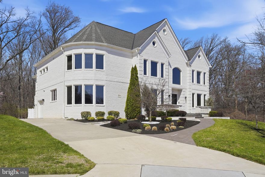 **MORE PHOTOS COMING SOON**
Experience a striking blend of contemporary design and refined craftsmanship in this custom residence by Potomac Custom Homes, completed in 2018 and ideally sited on a quiet cul-de-sac in The Reserves at Pinecrest. Backing to protected Fairfax County parkland, this property offers a rare combination of privacy, architectural presence, and thoughtfully curated indoor and outdoor living spaces.

Spanning nearly 10,000 square feet, this five-bedroom, six full bath home is defined by dramatic scale and modern elegance. Expansive glass elements and soaring vertical spaces create an immediate sense of openness, highlighted by 20-foot ceilings in the main living area and in the primary suite’s sitting room, with 10-foot ceilings throughout the remainder of the home. A custom floating staircase with fully enclosed glass railings extends through all levels, complemented by additional custom glass railings designed for both visual impact and enhanced safety.

Large-format Roberto Cavalli porcelain flooring flows throughout the main and upper levels, adding a cohesive and sophisticated aesthetic. Radiant heated flooring enhances comfort in select living spaces including the family room, kitchen, primary suite, primary bath, and a main-level den with direct access to the outdoor patio.

The chef’s kitchen is designed to impress, featuring custom Italian UNICA cabinetry, premium 3-inch DEKTON Aura waterfall countertops, and a professional GE Monogram appliance suite with induction range. The expansive island anchors the space, offering both functionality and a natural gathering point for everyday living and entertaining.

Throughout the home, GROHE designer fixtures and copper plumbing lines reflect a commitment to quality and longevity. A Control4 whole-home automation system provides integrated control of audio and key systems, complemented by a hardwired security system and a full-house Generac backup generator.

The home’s lower level and dedicated spaces elevate everyday living with a private home theater, golf simulator room, and a fully equipped home gym, creating a well-rounded environment for recreation and relaxation.

Outdoor living is equally impressive, designed for year-round enjoyment. A resort-style saltwater fiberglass pool is enhanced by a Pentair electric heating system, LED lighting, decorative waterfall feature, and an automatic cover. The expansive patio surrounds the pool and includes a built-in Weber gas grill, outdoor refrigerator, and integrated storage, creating a seamless outdoor entertaining experience. The upper-level primary suite extends outdoors to a private balcony retreat featuring a hot tub, offering an elevated space to unwind while overlooking the surrounding property.

Additional features include three Carrier HVAC systems for zoned climate control, a Rachio smart irrigation system with app-based weather-adaptive technology, and a spacious four-car garage with oversized eight-foot doors, epoxy-coated floors, and custom storage. A thoughtfully designed mudroom includes a built-in pet washing station for added convenience.

Located in Annandale, this home offers access to a variety of parks, golf courses, shopping, dining, and major commuter routes including I-495, I-395, Route 236, Route 7, and Braddock Road, providing connectivity while maintaining a sense of retreat.

This exceptional property brings together modern architecture, high-end finishes, and a private natural setting to create a truly distinctive living experience in Northern Virginia.