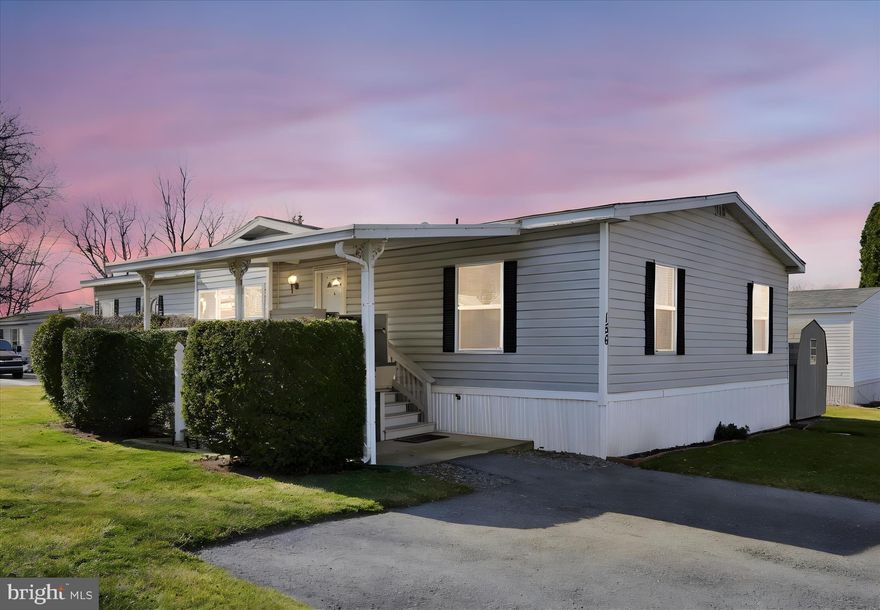 Welcome to easy living in Northcrest Acres! This tidy 3-bedroom double wide offers comfortable spaces and thoughtful features throughout. The spacious living room is highlighted by a beautiful custom wood-burning fireplace, creating a warm and inviting focal point. The kitchen provides abundant cabinet and countertop space, including convenient bar seating as well as room for a separate dining table- perfect for everyday meals or entertaining. The home includes three bedrooms, featuring a generous primary suite with a stall shower and relaxing soaking tub. Additional highlights include a dedicated laundry room, wide doorways, and a handicap-accessible shower in the main bathroom for added accessibility. An elevator lift from the parking area leads to the covered deck and directly into the home, offering ease of entry.
Located in the Northcrest Acres community (not a 55+ neighborhood), the property offers low-maintenance living with lot rent of $495 per month.