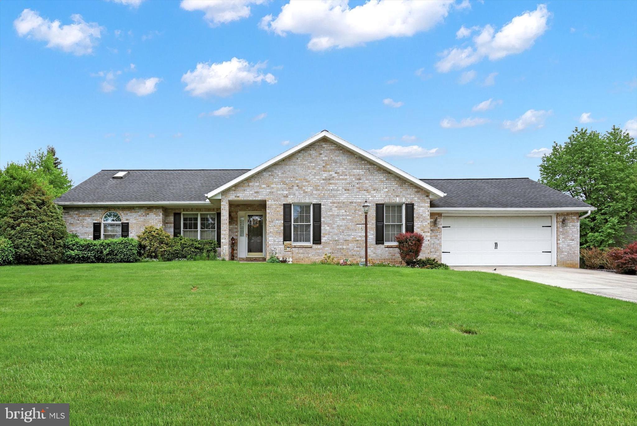 Brick front ranch in master-planned Penn National Community! This home features a customized Westwind floor plan. Three bedrooms, two baths. Welcoming front porch leads to Great room that has cathedral ceilings, ceiling fan, and fireplace. Primary suite has walk-in closet. Main level laundry is conveniently situated between the kitchen and oversized garage. Unfinished basement has potential for storage and flex space. Schedule your tour today!  Lovely walkable community offers 36 holes of 4-star golf, outdoor pool, tennis/pickleball, yoga, community garden, 40 + social clubs, restaurant/bar, and so much more!!