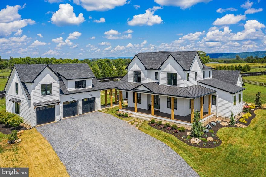 Built in 2019, this luxurious modern farmhouse situated on 10+ peaceful acres offers 6,110+/- square feet of finished living space. The large windows and gorgeous hardwood beams and flooring throughout, evoke a feeling of being in touch with nature. The thoughtfully designed home has multiple living areas perfect for entertaining and daily living, including a combination living/eat-in kitchen area with views you can’t miss, a separate dining room, and an inviting patio! The kitchen is a chef’s delight offering a commercial range, massive island with seating, and breakfast area. Just off the kitchen, you’ll find the mudroom, a full bathroom, and laundry room. Relax and unwind in the main floor primary suite offering a spa-like bathroom with a soaking tub, standing shower, and walk-in closet. The additional full bedroom and bathroom finish off the main level. On the lower level, you’ll find a media room, a full bedroom and bathroom, and gym that are all conveniently accessible from the walk-up rear entrance. Above the detached 3 car garage, you’ll find a 1 bedroom, 1 bathroom apartment with a combination living/kitchen area. Working at home could not be easier with the standalone studio/office just out the front door. This freshly landscaped, fabulously designed home conveniently located 10 minutes from Berryville and 20 minutes from Middleburg and Winchester will not last long!