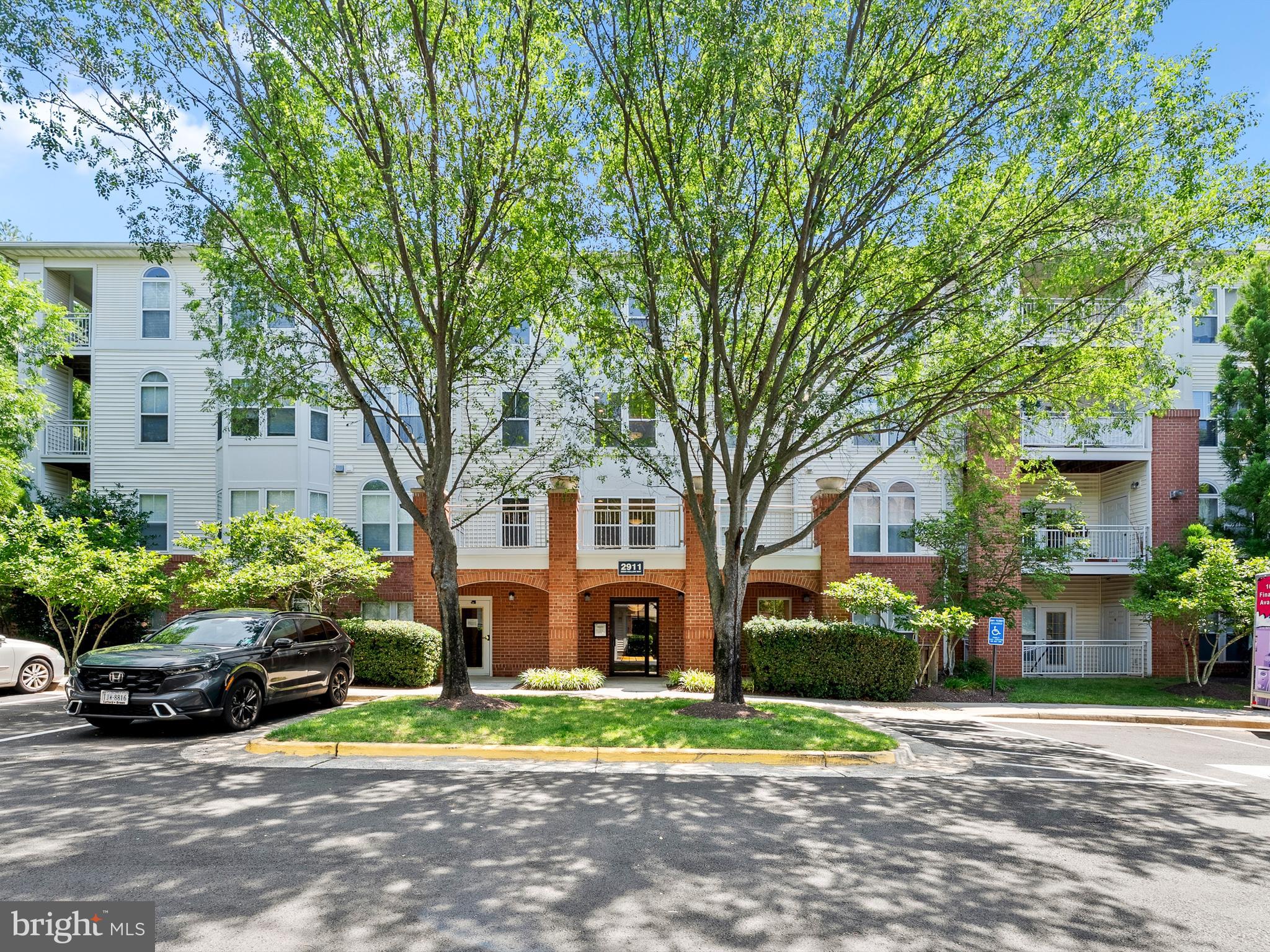 Welcome home to this beautifully maintained 2-bedroom, 2-bathroom ground-level condo offering the perfect blend of space, comfort, and unbeatable convenience. Located in a sought-after Fairfax community, this unit features generously sized bedrooms and bathrooms, an abundance of closet space, and a full-sized washer and dryer tucked away in a private hallway nook.
Enjoy seamless access to the Metro—just blocks away, making your commute a breeze. The unit includes one assigned garage parking space. During the warmer months, take advantage of the community’s outdoor pool—ideal for relaxing.