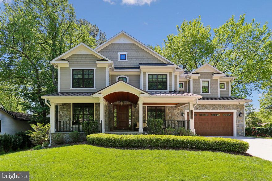 This stunning custom home in the highly desirable White Flint Park subdivision blends timeless elegance with modern comfort and offers 5 bedrooms, 4.5 bathrooms and over 6,100 square feet of living space. From the moment you arrive, the expansive front porch with its custom wood ceiling and impressive oversized front door sets the tone for the thoughtful design found throughout the home. Inside, custom fixtures, crown moldings, and recessed lighting create a warm yet sophisticated ambiance.

The main level is perfectly designed for both everyday living and effortless entertaining. Richly refinished hardwood floors flow throughout, leading to a private office with French doors and built-ins, as well as a living room, a banquet-sized dining room and a butler’s pantry with a beverage refrigerator. The heart of the home is the gourmet kitchen, featuring quartz countertops, soft close cabinets and drawers, a marble subway tile backsplash, stainless steel appliances including two ovens, two dishwashers,  refrigerator and built-in microwave, an oversized sink with a reverse osmosis system and a walk-in pantry. A center island with a prep sink and instant hot water anchors the space, while the adjoining breakfast area opens seamlessly to the inviting family room with a coffered ceiling, stone gas fireplace, and custom built-ins. Just beyond, a spectacular screened-in porch offers year-round enjoyment with its cathedral ceiling, skylights, ceiling fan, and a second gas fireplace, with stairs leading down to the back yard perfect for relaxing or entertaining. A well-appointed mudroom with cubbies, bench seating, and an additional refrigerator adds everyday convenience, along with a stylish powder room.

Upstairs, a versatile family/office area with a built-in desk provides additional space for work or relaxation. The luxurious primary suite serves as a true retreat, featuring hardwood floors, a tray ceiling, and two spacious walk-in closets. The spa-inspired primary bath includes dual marble vanities, a soaking tub, and a large frameless glass shower with a bench and two showerheads. Three additional bedrooms offer generous accommodations, including one with a private en-suite bath, while the others share a beautifully designed bath with dual sinks and a frameless glass enclosed shower. A spacious laundry room with cabinetry, counters, and a sink completes the upper level.

The fully finished walk-out basement is filled with natural light and offers exceptional flexibility, featuring luxury vinyl plank flooring, a dry bar with refrigerator, a dedicated theater room, and an exercise room with rubber flooring. An additional bedroom and full bath make it ideal for guests, while a bonus room, ample storage, and a utility room with sink provide added functionality.
Outside, the fully fenced rear yard with two gates and a beautiful stone patio creates a lovely outdoor space.
 Additional highlights include a two-zone Nest thermostat system, multi-zone surround sound throughout the home and the porch, a sprinkler system, rough-in for an elevator, and an attached two-car garage with shelving.
Located within the sought-after Walter Johnson High School cluster, this exceptional home offers a rare combination of luxury, space, and convenience.