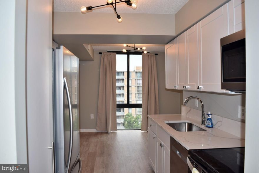 THE BRITTANY - A Luxury Condominium 
Experience the charm and sophistication of this exquisite, fully-renovated, 1-bedroom, 1-bathroom residence, complete with a versatile den and a private balcony offering spectacular treetop views. Also includes upgraded level-5 quartz countertops. The unit is freshly painted with designer colors - trims and ceiling as well. This move-in-ready, open-floor plan condo features wall-to-wall, floor-to-ceiling windows and gleaming LVP floors with new baseboards and shoe-molding. Brand newly completed with commercial washer/dryer unit, stove, vanity counters, light fixtures, dishwasher, refrigerator, custom built-in pantry, and ample closet space. Enjoy luxury amenities including a fitness center, inviting club room, refreshing pool, and  mailroom system. Additional highlights: a welcoming 24/7 front desk, attentive concierge service, billiards room, business center, and a media room perfect for entertaining. With a designated outdoor parking space (street parking for guests), and extra storage unit, this residence is not just a home—it's a lifestyle. Discover your new sanctuary today!

Pending: Front door to be painted by Condo Association**