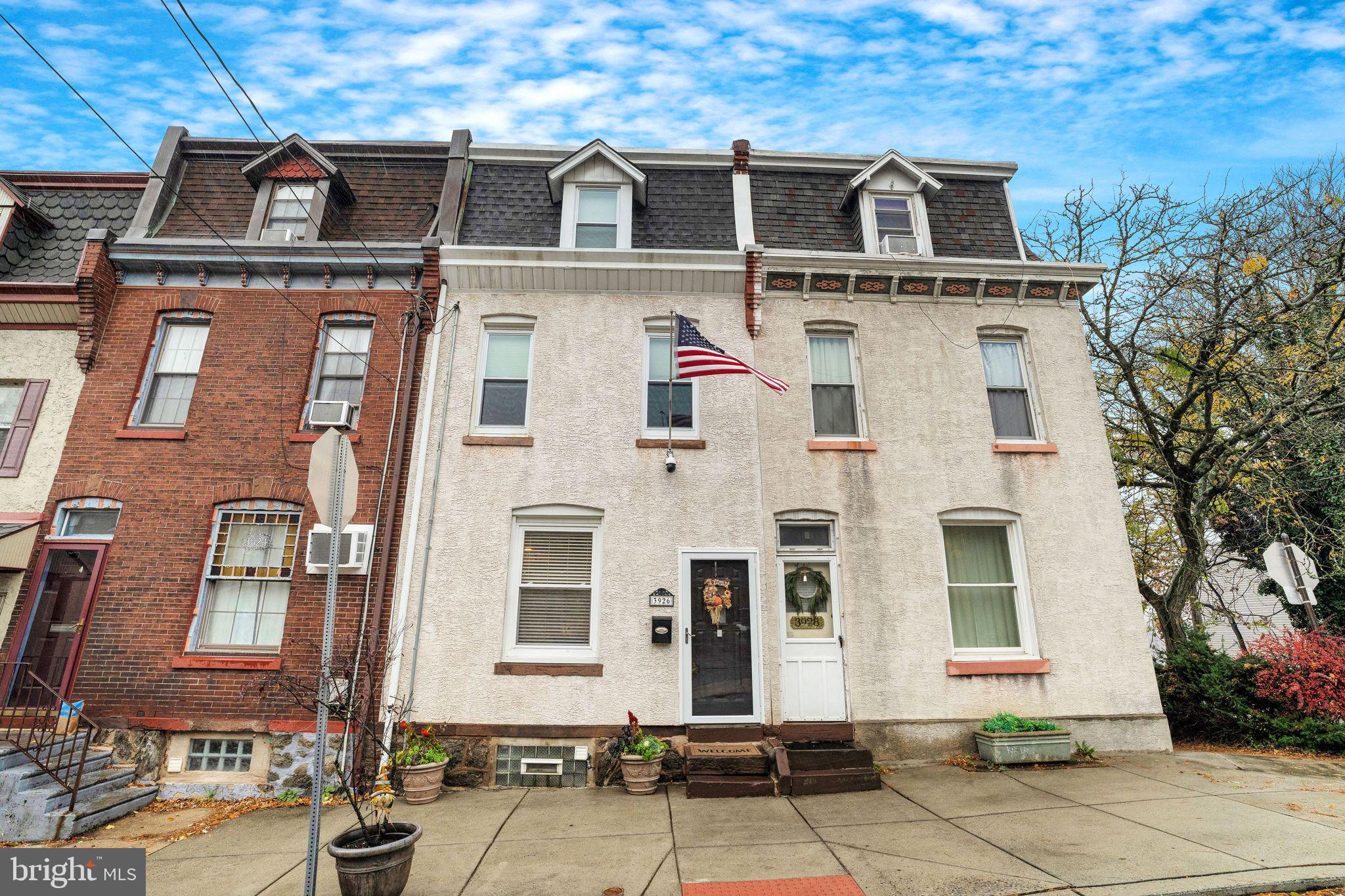 Welcome to this stunning 3 bedroom, 3 bath townhome in Manayunk This home has so much to offer! It has been remodeled over the years which has taken it to its contemporary form. 
The long time owners have taken great care with all of the appointments from the design of the alcoves, custom made radiator covers, vaulted ceilings, crown molding and recessed lighting, that are especially apparent in the living room and dining room areas. Moving on to the modern kitchen there are carefully selected quartz counter top, shaker style cabinets with soft close doors. There is glass tile backsplash and recessed shelving under the counter area too. From there you can enjoy your morning coffee or tea on the balcony with views of Manayunk and Bala Cynwd. You are also greeted by a rare, mature dawn redwood tree along with a red maple. To get a closer look, walk downstairs on the hardwood floors past a family room, full bathroom, workshop, storage, utility and workout area to the backyard oasis where you are ensconced in nature. It gets better!  The second floor has two bedrooms and updated bathroom and if you desire a 2nd story laundry area, there is a panel that allows for water hookup for a washer and there is a gas line and exhaust for the dryer. The thirds story, we call the master suite, where there is a sitting room, pocket doors built in the bedroom and in the sizable bathroom. There are also 2 cedar closets on this floor. This home is move in ready! Buy with confidence! Walkable to everything Manayunk has to offer, from shopping, restaurants, entertainment, schools, healthcare, nature, public transportation and more! Make your appointment today. It won’t last!