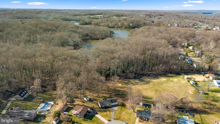 Must see, lovingly cared for single family value on a prime 1/2 acre lot ideally located to South River waterfront! Premium cul-de-sac lot backing to woods, open space and an easy walk through neighbors wooded lot to Beards Creek and South River. Endless improvements by the seller include: new roof (w/transferable warranty), soffit, gutters and leaf guard (all installed Dec 2023); new water heater (2021); new HVAC (2019); new windows (2009); new well pressure tank (2022); oversized 2-car garage w/extra work space and overhead storage; freshly painted w/neutral colors (Jan 2024); gleaming hardwood floors; bright 3-season sunroom off the kitchen; easy care rear deck; kitchen w/replaced appliances; main level w/3 bedrooms and 2 full bathrooms; fully finished lower level ideal for an au pair or in-law suite w/wood burning stove in expansive rec room, possible 4th bedroom/home office, storage room, 2nd kitchen and laundry room; huge, quality built rear shed conveys. Zoned for sought after South River High School. An amazing location to shopping, restaurants, Annapolis, NASA, Ft. Meade, NSA, DC and BWI. Better hurry to this tremendous value.