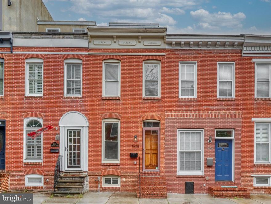 Beautifully renovated Federal Hill home with 4 finished levels , private parking & rooftop deck! Walk in to find a large open first floor with wood floors, recessed lighting, exposed brick and separate living and dining rooms, powder room,  spacious kitchen with stainless appliances, granite counters and tons of cabinet space plus a breakfast room that walks out to the rear parking pad. The 2nd level has 2 spacious bedrooms both with large closets, 2 full bathrooms, and laundry room. The 3rd level has a wet bar and access to the rooftop deck.  The finished lower level is perfect for the 3rd bedroom, home office or family room and has it's own full bathroom.