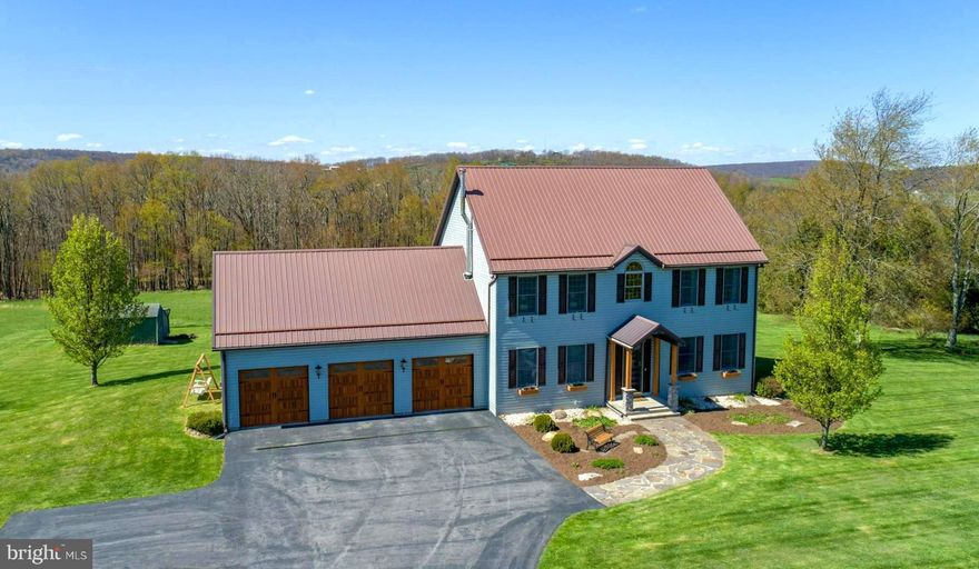 Views for miles on this 5.05 acre property with 4/5 BR Home, huge 3 car garage & shed.  Main floor has office/BR with full bath,  open kitchen/dinning,  living room, laundry area, and bonus room for formal dining or bonus room.  Main level boasts 10 foot ceilings, new modern kitchen with updated appliances,  outside deck area off dinning and large foyer with 20 ft ceiling. Upstairs there are 4 BRs, with 2 full baths.  The master Bedroom is huge with on-suite bath, tub and shower.  Lower walk out level has wood burning stove and large recreation/living room.  Utilities , extra fridge and storage on basement level. Central Air & Forced air propane heat. HOA pays for road maintenance and plowing.    Open yard with plenty of space for gardening, or a horse? Call today for your private showing of the well maintained, updated traditional home!