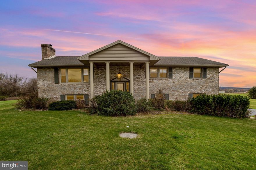 This beautifully maintained brick home, set on a tranquil acre of land, is sure to capture the hearts of buyers! The main level features a spacious family room, a bright and inviting kitchen, a separate dining area, three cozy bedrooms, and a full bath. Downstairs, the expansive living area includes a charming fireplace and a second full bath. Features a 2 car side entry garage. Step outside to the back patio, where you can unwind under the pergola and enjoy the breathtaking views. Offering the best of both worlds, this property combines the peacefulness of rural living with the convenience of being just minutes from the highway, ensuring easy access to all your essentials.