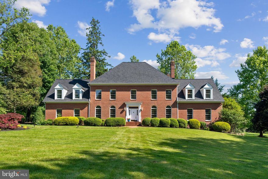 This elegant home is sure to impress - seated on over 3 acres of luscious greenery with enduring curb
appeal, a back deck, and a fenced front yard. An impressive foyer welcomes you to the formal living room with coffered ceilings and a wood fireplace, formal dining room with floor-to-ceiling Palladium windows, a brick fireplace, and statement lighting, plus a den or study and 2 full bathrooms. Relaxation awaits in the large family room with cathedral ceilings, skylights, triple access to the large deck, and a wood fireplace.
A cook’s dream, the eat-in kitchen is equipped with Corian counters, white cabinetry, a built-in wine rack,
decorative pendant lighting, an island, and a bright breakfast area with access to the deck.
Retreat to the huge owner’s suite with a sitting room and spa-like bathroom featuring double vanities, a
gleaming walk-in shower with a shower bench and two waterfall showerheads, a separate toilet, and a
soothing soaking tub. All other bedrooms include sizable closets. Additional loft space on the upper level impresses with ample natural light from skylight windows. One additional bedroom resides on the lower level. The finished lower level hosts a rec room with a brick fireplace and walkout access to the enclosed stone patio, bonus room, and full bathroom. Enjoy space for your vehicle, tools, and/or equipment in the 2-car garage with additional parking spaces at the end of the long driveway. Embrace entertaining on the back deck overlooking the meticulously manicured backyard with a stone pathway leading to an in-ground whirlpool tub with bench seating. This sought-after community offers proximity to dining and shopping on Route 40, nearby access to Highway 70, 29, and 695, and a short drive to BWI Airport for a weekend getaway. Great location for DC and Baltimore commuters.