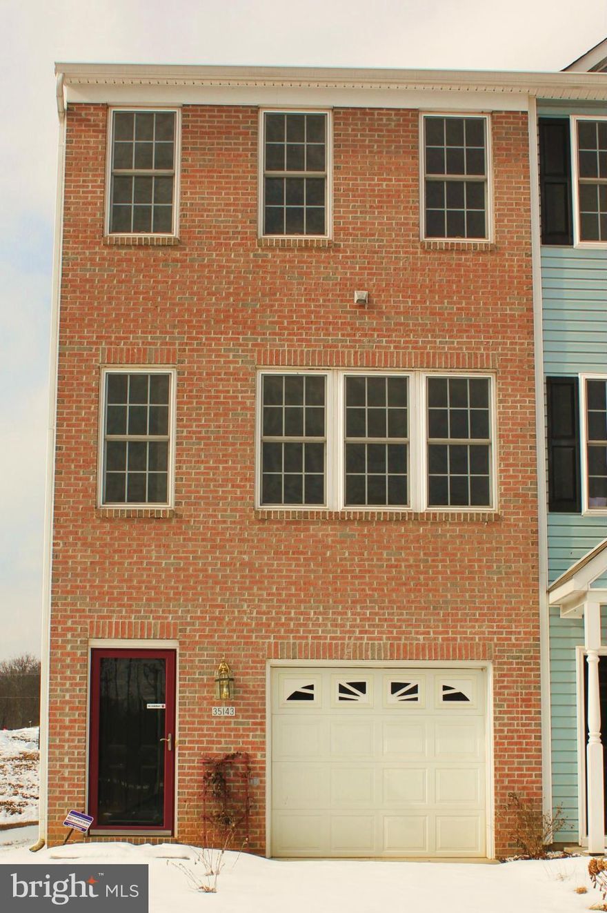 This Beautiful Brick Front End-Unit Townhouse is Move-in Ready. Open Floor Plan Loaded with Upgrades. Spacious Open Kitchen with Upgraded Appliances. 2 Marble Wrapped Gas Fireplaces in Both Living Room and 3rd Bedroom/Office. Large Garage with Lots of Storage Space. 90-120 Days from Contract to Settlement!