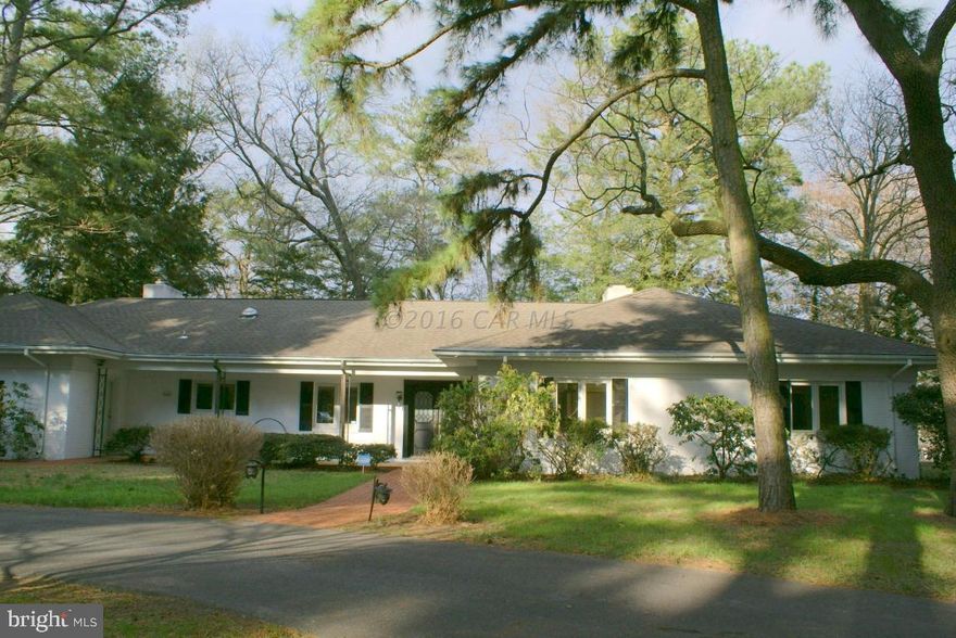 Private Waterfront Brick home with views of Tony Tank Lake.  Large spacious rooms with flexible floorplan.  Kitchen features custom wood cabinets, breakfast area, center island, corian countertops. Enjoy waterfront views from the Living Room with an imported Italian marble fireplace with solid oak mantle and gas logs.  Family room has authentic old fireplace with two baking hearths and kettle arm for cooking, built-in bookcases and views of the lake .  Enclosed window filled Sunroom with flagstone floor has central heat/ air  leads out to a large deck overlooking the water.  Master bedroom has double closets, with a private bathroom that includes a steam shower. 4 car detached garage. blacktop driveway. Privacy in the heart of the city !