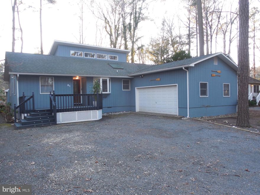 Recently updated and brightened home in the heart of the North Pines.  Large entertaining room with hardwood floors, vaulted ceilings and two sets of double doors that open to an additionally spacious all season room featuring a wall of windows and a gas fireplace.  The spacious eat-in kitchen boasts solid oak cabinetry, a skylight, and a window bay for maximum light and recently upgraded lifeproof flooring.  The sizable primary bedroom includes a bathroom with a new double vanity and makeup area. The room features sliding glass doors leading to a private deck overlooking the spacious backyard.  There are two additional rooms with a second bathroom, inclusive of a newly tiled shower.  The extra large driveway leads to a 2 car garage with additional overhead storage.   The backyard has been cleared to allow for all of your year round enjoyment, with a gravel seating area and beautiful flower beds that bloom from spring to late fall.  The yard also includes a heated/cooled shed with built in cabinetry that can be used as an exercise, surf storage or for additional outdoor entertaining.   A great year round home or multi season escape!