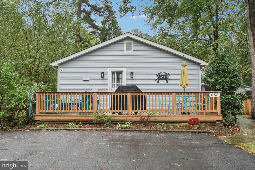 Recently renovated, turnkey 3 BR/1 BA home with single floor living located 600 feet from the Chesapeake Bay, a waterfront community park, and two restaurants.  Two generously sized bedrooms come equipped with spacious closets, window treatments, and ceiling fans. The third bedroom can be utilized as an office or a cozy spot for twin sized bed or bunk beds.  The kitchen is also newly renovated with quartz countertops, a workstation, and space for bar stools. Stainless steel refrigerator, built-in microwave, oven/stove, and dishwasher (all new in 2022) included. A spacious dining room is situated right off the kitchen. The home also has a recently renovated modern bathroom with a walk-in shower. The living room can accommodate a full sectional and features a ceiling fan and coat closet. On-site laundry is available with a new stackable washer and dryer. The house has two decks, a new roof (replaced in 2023), and a partially fenced back yard. The newly paved driveway can accommodate 2 or 3 vehicles, and a maintenance-free shed is available in the backyard for storage. Home has central heat and air (HVAC system replaced in 2022) as well as optional baseboard heating. Easy commute to Annapolis or DC. The home is in a quiet friendly neighborhood- A Must See!