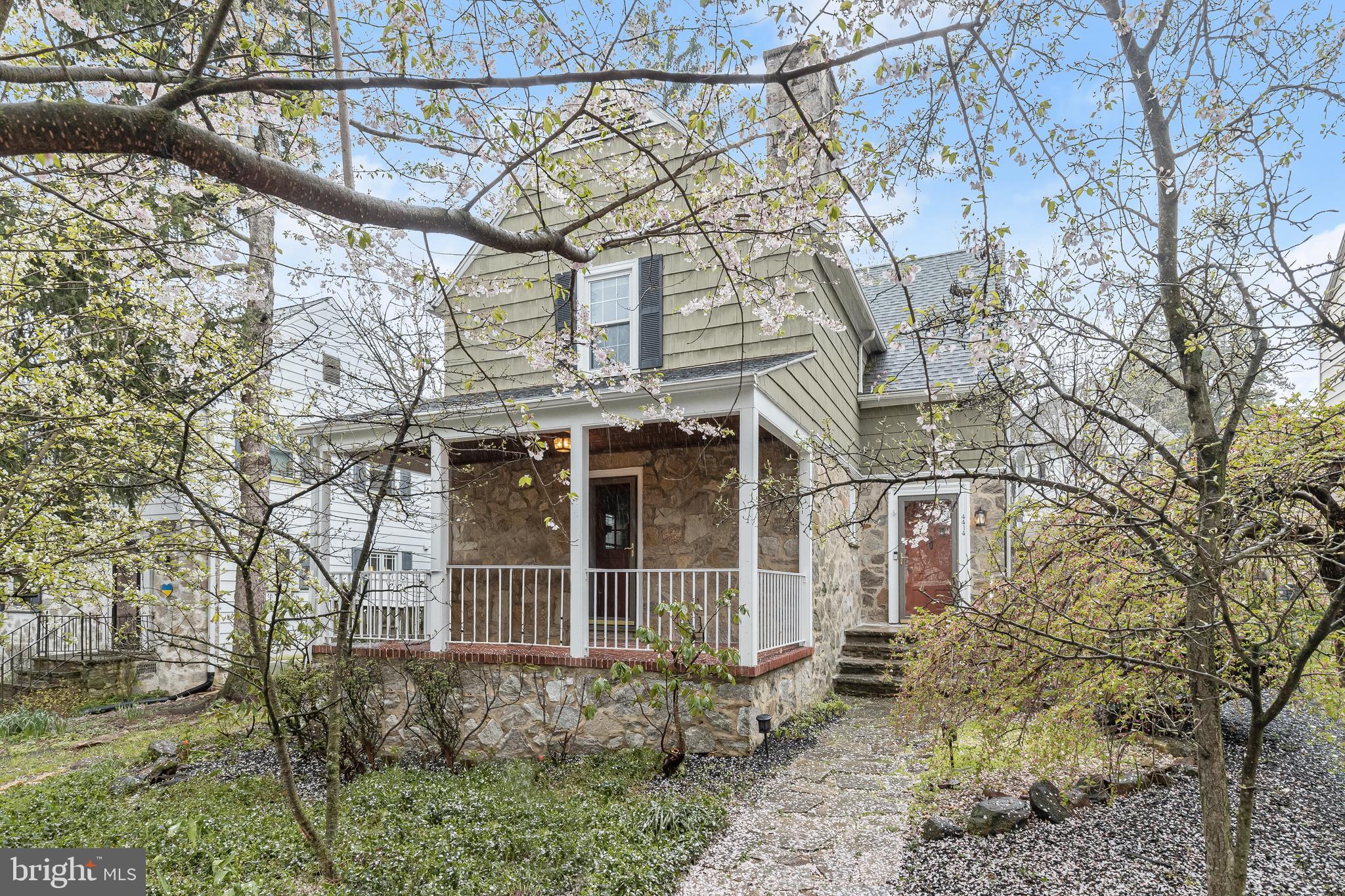 Discover the charm of this exceptional four bedroom cottage-style residence nestled in the sought-after Keswick neighborhood, just beyond Roland Park. As you step through the front door, you're greeted by a foyer featuring a convenient coat closet and a half bathroom. Hardwood floors and a soothing neutral palette invite you further, hinting at the inviting atmosphere that lies beyond. The spacious living room boasts a striking brick fireplace with a mantel and built-in shelving. An inviting Dutch door opens onto the front porch, offering a peaceful retreat with views of the lush gardens and fruit trees. The formal dining room exudes elegance with its chair railing, dimmable wall sconces, and a swinging door leading to the butler’s pantry. The updated kitchen is a culinary delight, featuring granite countertops, stainless steel appliances, accent ceramic tile backsplash, soft-close cabinets, and heated tile flooring—ideal for colder days. A door off the kitchen leads to the back porch overlooking the rear yard. Upstairs, the primary bedroom beckons with sun-drenched windows and ample closet space. A full bathroom with a tub-shower and three additional bedrooms complete the upper level. The lower level presents a spacious recreation room adorned with bamboo flooring, exposed stone walls, a fireplace, and another full bathroom. Nearby, the utility room offers abundant storage, along with laundry facilities and walk-out steps to the rear yard. Outside, revel in your own private sanctuary within the fully fenced rear yard, boasting meticulously manicured landscaping, stone retaining walls, a tranquil pond with a waterfall feature, a teak deck, and a serene ambiance. The detached two-car garage provides secure parking and extra storage space, completing this idyllic oasis.