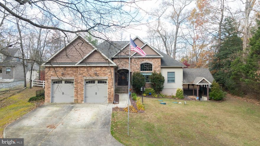 Step into a space filled with natural light—thanks to an abundance of windows that make every room bright and cheerful. The open floor plan seamlessly connects the main living area with a formal dining room, creating the perfect setting for gatherings. Just off this space, you’ll find two bedrooms and a full bath for convenience.
The kitchen is a chef’s dream, featuring granite countertops, and an extra-large refrigerator/freezer for all your culinary creations. Adjacent to the kitchen is the main-floor laundry room, with access to both the finished basement and the attached two-car garage.
The main-floor owner’s suite offers two closets, a luxurious glass-block shower, and a relaxing corner soaking tub—your private retreat.
Head downstairs to discover a finished basement designed for entertaining, complete with a built-in bar, space for a pool table, and a full bath. There’s also a spacious office with its own patio, perfect for work-from-home or multi-generational living. It’s like having a private apartment or the ultimate game-day hangout!  
Outside, enjoy a large backyard with an above-ground pool and a deck ideal for lounging or hosting summer parties. Best of all—this beautiful home comes without the restrictions of an HOA!
Privately situated on River Road near the Woodland Ferry, this property offers the perfect blend of comfort and seclusion. Don’t miss your chance to make it yours!