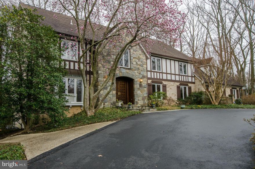 Room for extended families or home business. Geothermal system = low utility bills for a home of this size. This well built, bright, brick & stone home has many fine features; circular driveway, main level laundry & study/library,  2nd front entrance to back staircase, herringbone design wood floors and fine moldings. 7 BR's on upper level all good sizes. Walk-out LL. Walt Whitman HS No HOA