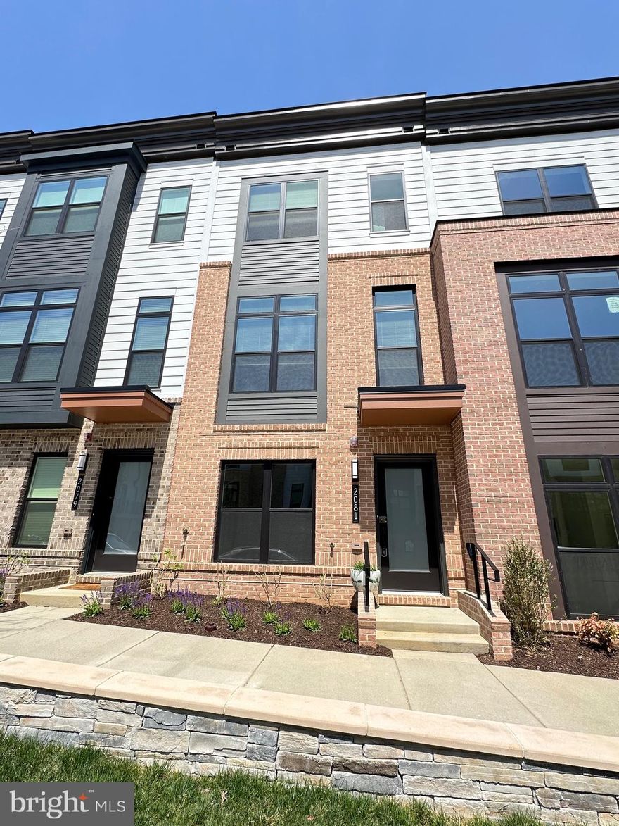 New Construction Townhouse in Tysons Ridge is ready for moving in! This three-bedroom, 3.5 bathroom townhouse is a four level home with a lovely roof deck. The main floor features a gourmet kitchen with state-of-the-art stainless steel appliances, beautiful countertops, and a spacious Quartz island . All three bedrooms all features en-suite bathrooms with luxurious finishes, a walk-in closet, and stunning views of the surrounding area. Tyson's Corner, convenient access to shopping, dining, and entertainment are just outside your door. This new construction is equipped with energy-efficient appliances and is all ready for it's first ever occupant!