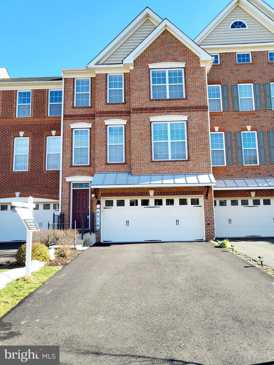 MARLBORO RIDGE BEAUTY TH w/ 2 Car Garage & 4 Foot Marque Extension on All 3 Levels... 
This Toll Brothers Bradbury Model has 3 Bedrooms, 2 Full Baths, & 2 Half Baths. Owner's Suite has 2 large walk in closets, Sitting Area. Owner's Suite bathroom has soaking tub with separate shower & double sinks! This beautiful townhome also has a walkout lower level / brick front, 3 finished levels - 3000 SF with finished Rec. Room & Family Room with gas fireplace. Open floor plan with hardwood floors and soaring ceilings.  vaulted ceilings in ALL bedrooms, formal dining and formal entertaining, 42” cabinets, granite/kitchen island, hardwood foyer/stairs to main level. Convenient 3rd level laundry.  Large private fenced yard with 24' x 14' HUGE DECK and a 24' x 12' moon shaped stone patio.   Garage 2 car + up to 4 car driveway ample guest parking.  Clubhouse w/ fitness-center, pool, & much more! Hiking & biking trails w/ scenic views.