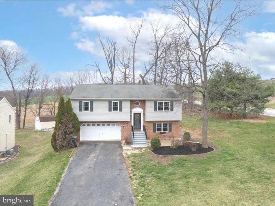 Welcome to your new home that will bring you many perfect summer days of fun! This charming split-foyer home sits on just shy of a half an acre and offers 3 bedrooms and 2.5 baths. The bright and airy main level features an open-concept living and dining area, perfect for entertaining. The kitchen boasts ample counter space  island and storage.  The skylights  bring brightness to the dining room area and doors leading out to the deck. The deck off of the dining room has a retackable awning. Downstairs, you'll find a cozy family room with a fireplace, ideal for relaxing. Step outside to your private backyard oasis featuring  a 24 ft  round pool.  With great conveniences with a wet bar and bathroom right inside from the pool area.   The yard has an invisable fence for you critters. With plenty of outdoor space for gatherings, gardening, or play, this home is a must-see. Don’t miss out—schedule your showing today!